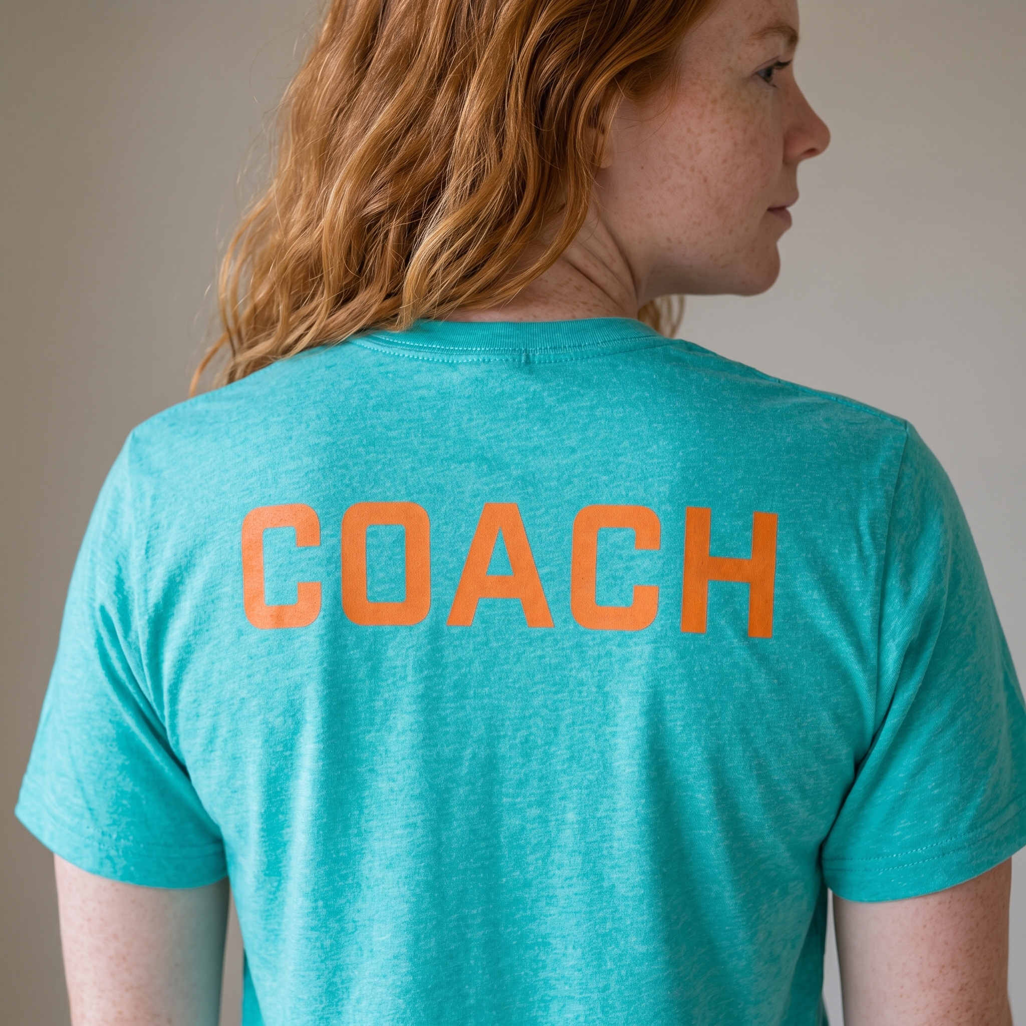 ATL Fitness coach back tee with orange COACH print