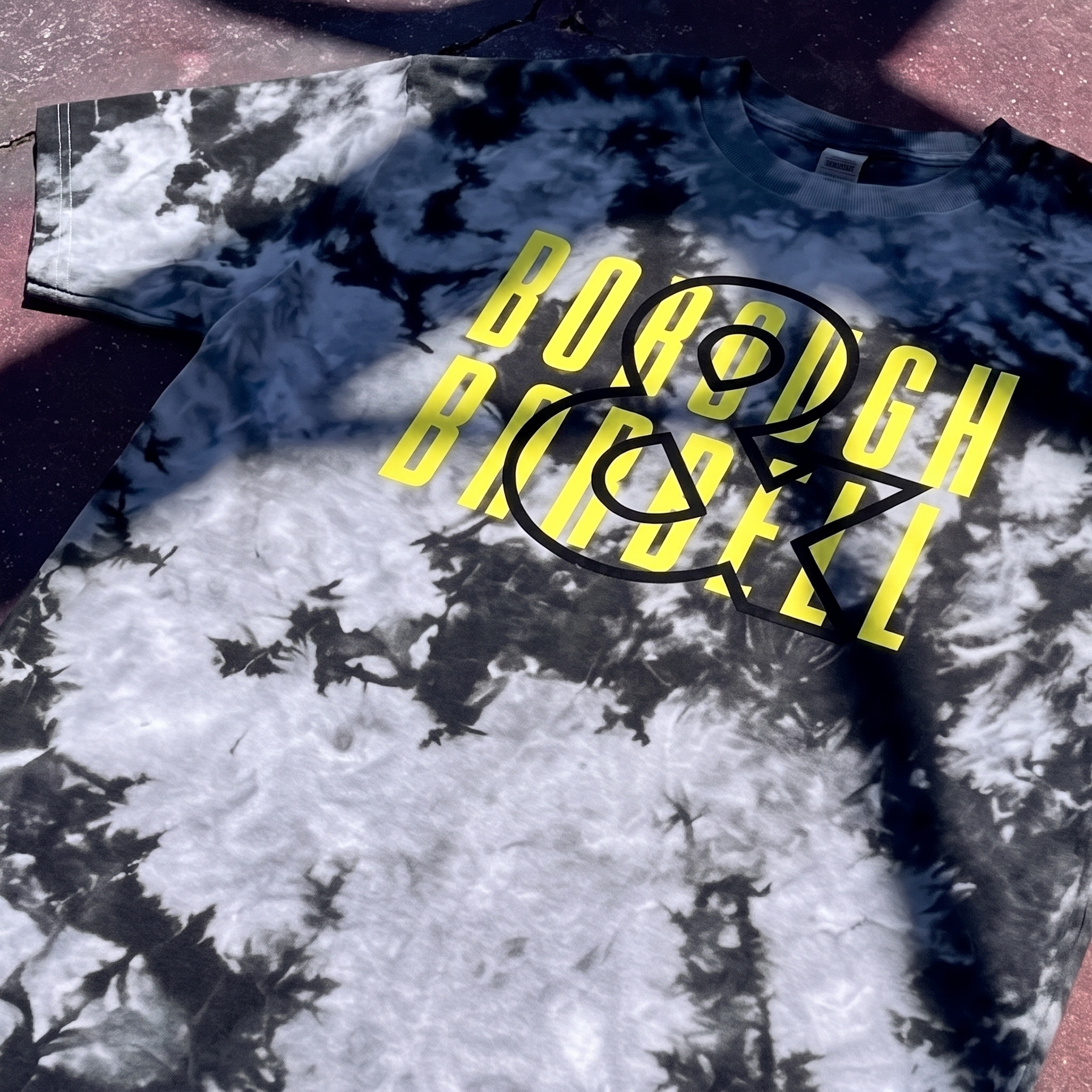 Borough & Barbell pigment dye tee with yellow stacked type and BB bridge icon