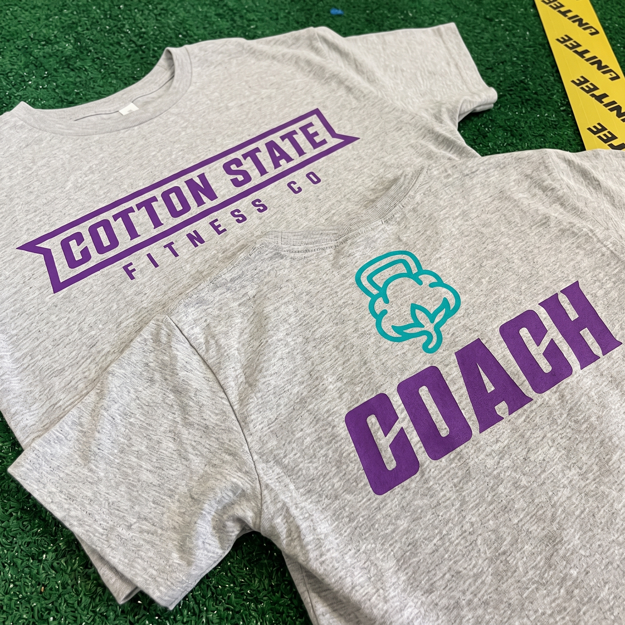 Cotton State Fitness Co. grey coach shirts with purple and teal artwork