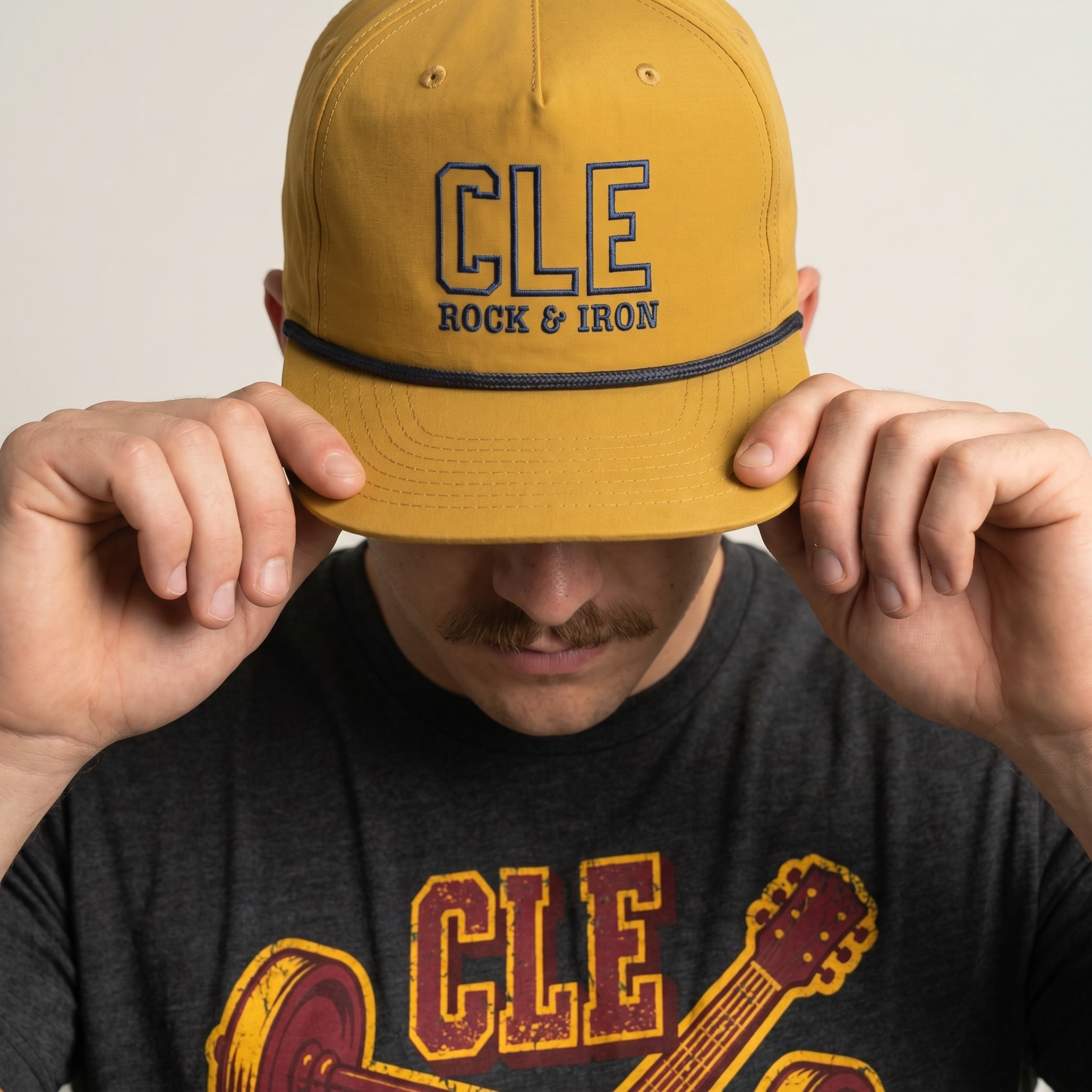 CLE Rock and Iron gold rope hat with embroidered CLE Rock and Iron mark
