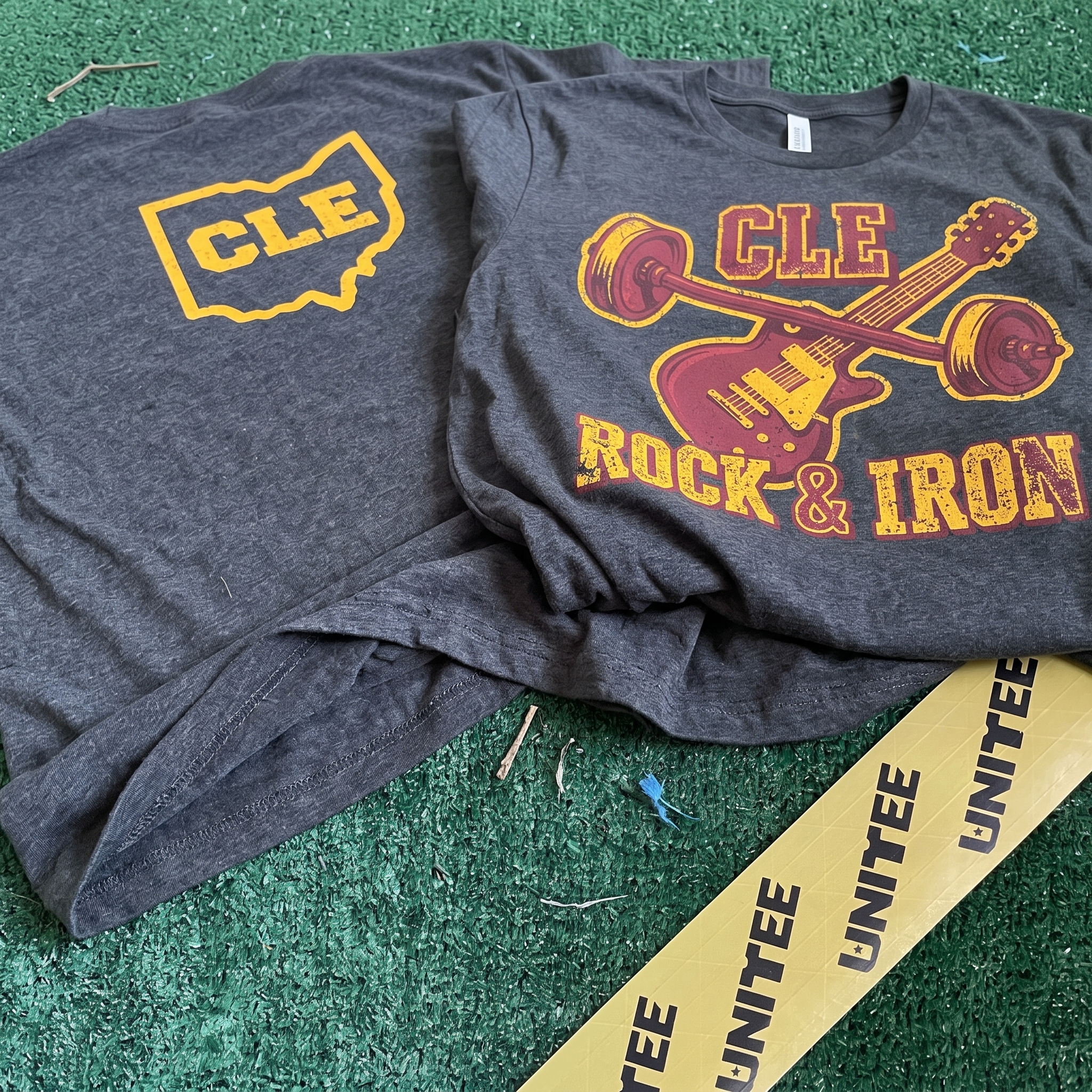 CLE Rock and Iron charcoal tee with front guitar-barbell print and Ohio CLE back print
