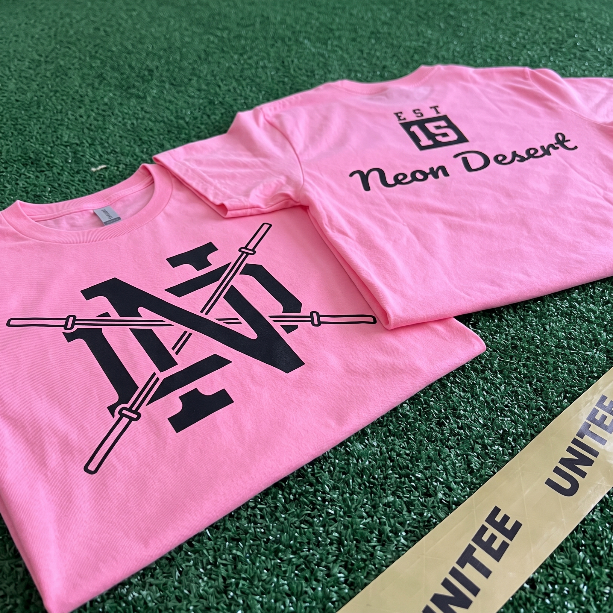 Neon Desert full collection with hoodie, joggers, hats, checkerboard tee, and coach gear