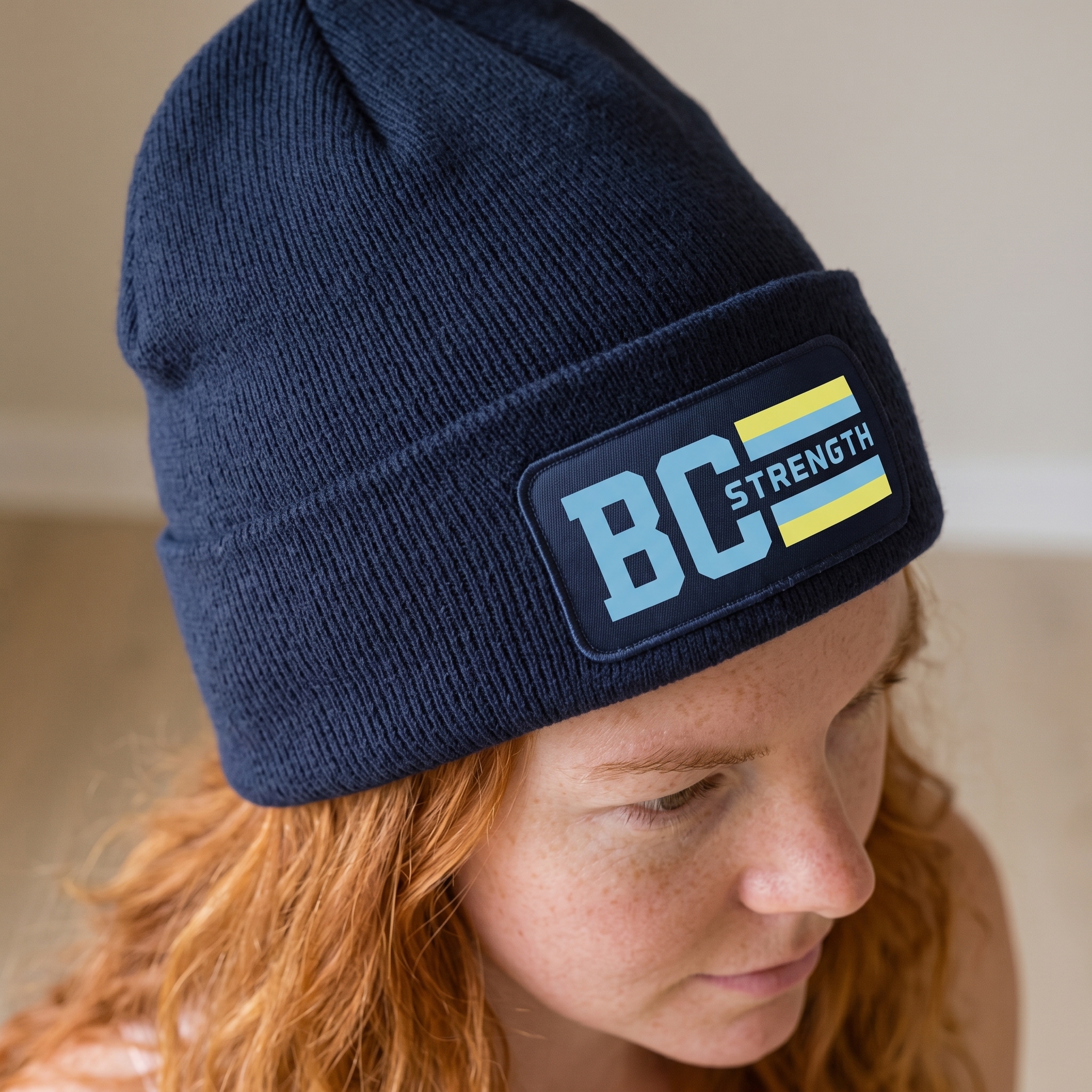 Bluff City Strength Co navy beanie with BC Strength woven patch