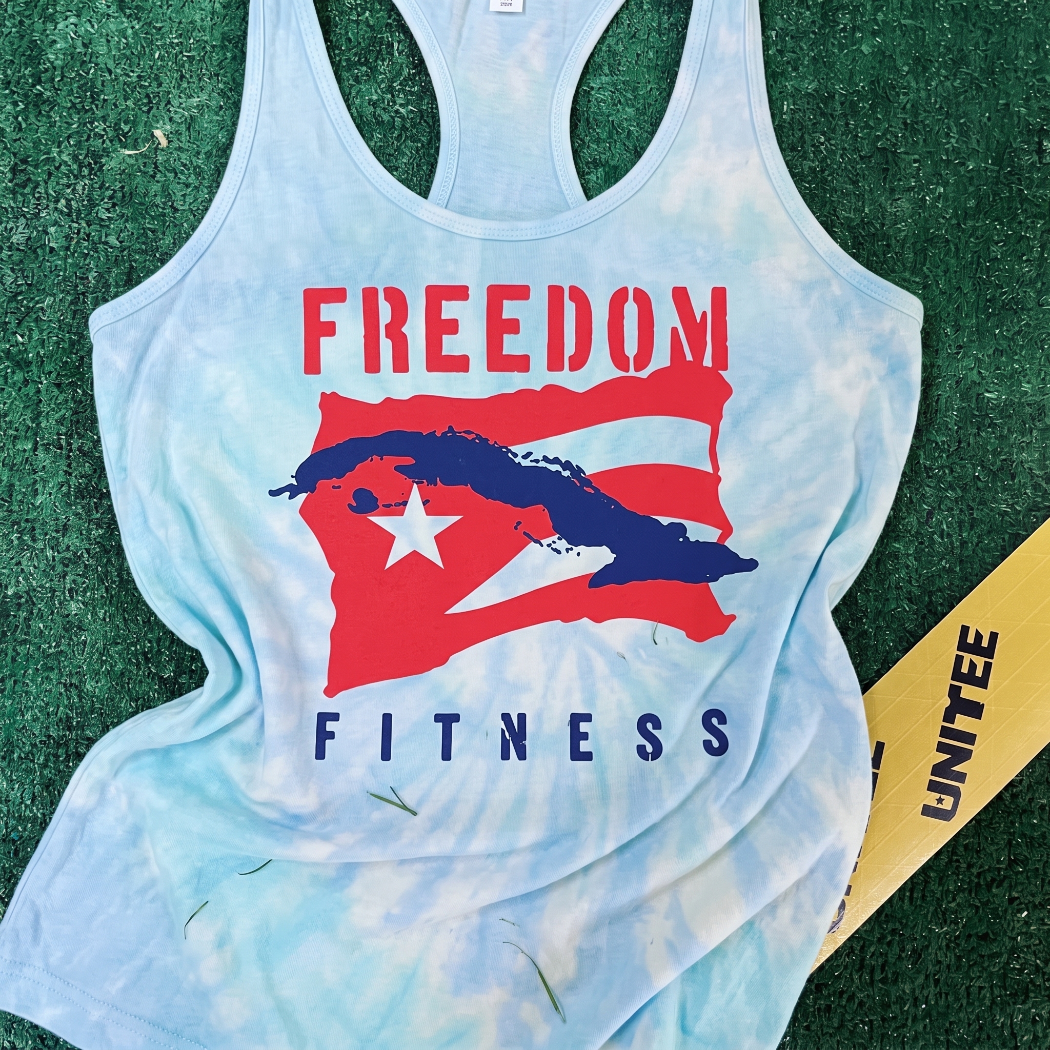 Freedom Fitness light blue racerback tank with Cuban flag inspired Freedom Fitness graphic