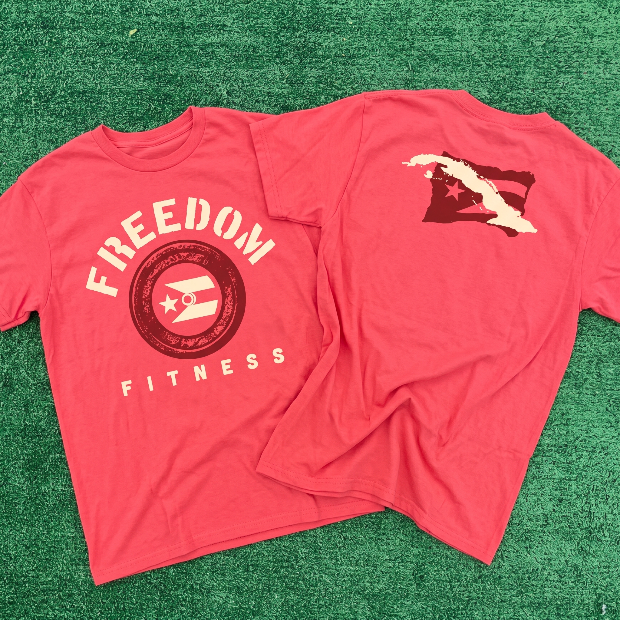 Freedom Fitness coral tee with circular front graphic and Cuban flag inspired back neck print