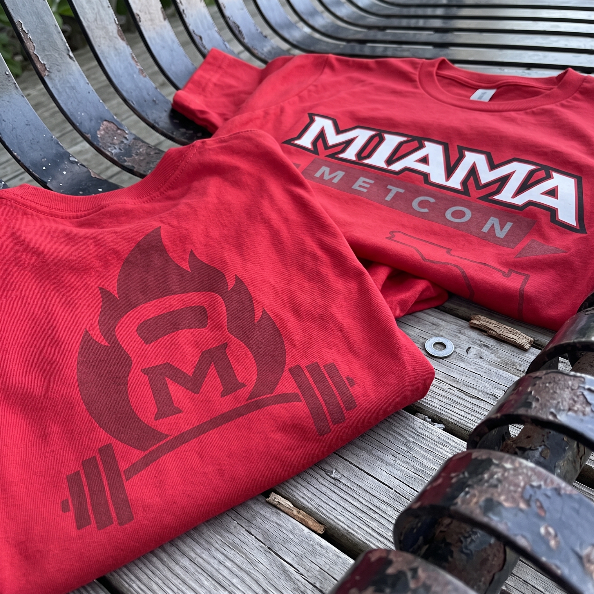 Miami Metcon red tees with front lockup and tonal kettlebell flame back print