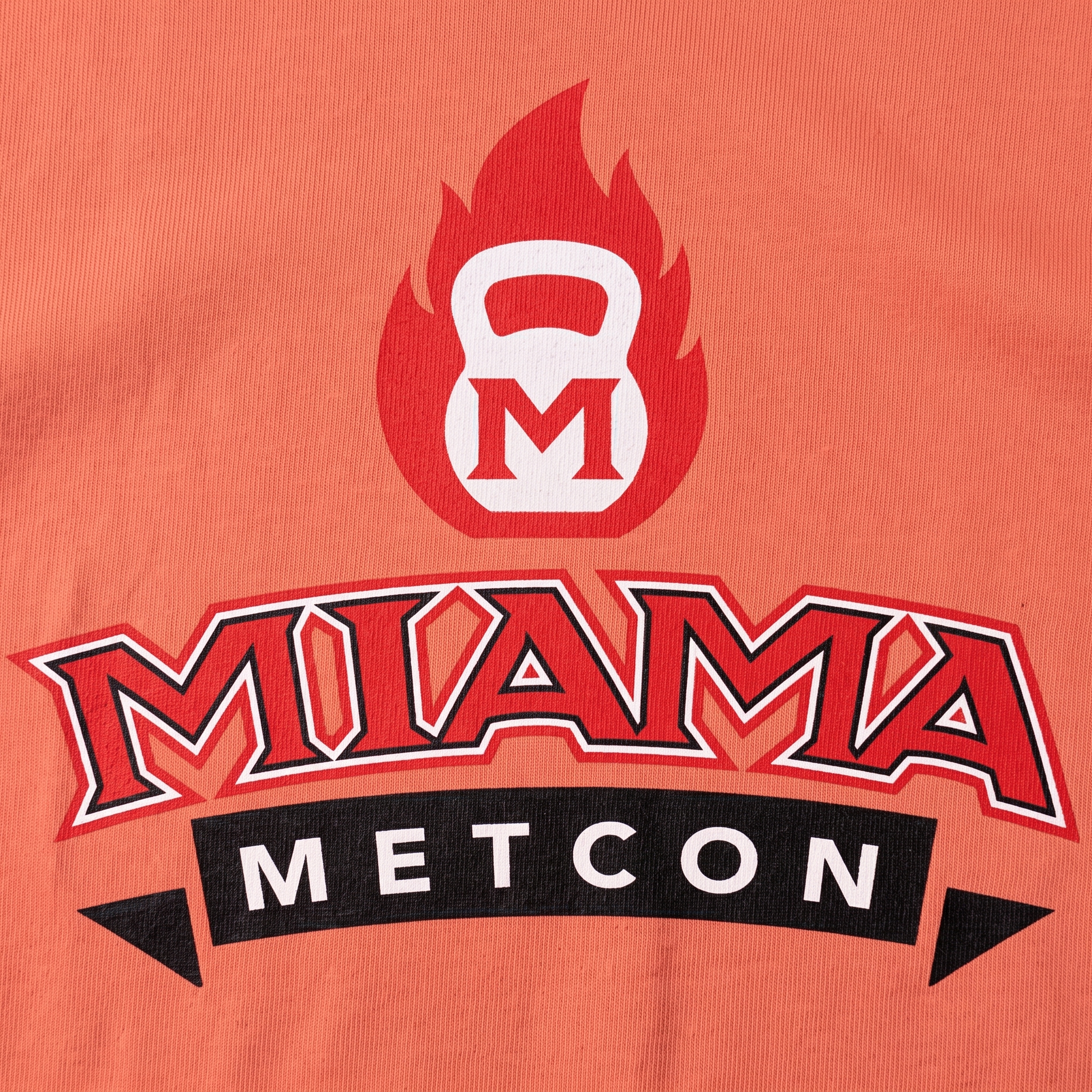 Miami Metcon screen printed logo detail with kettlebell flame mark