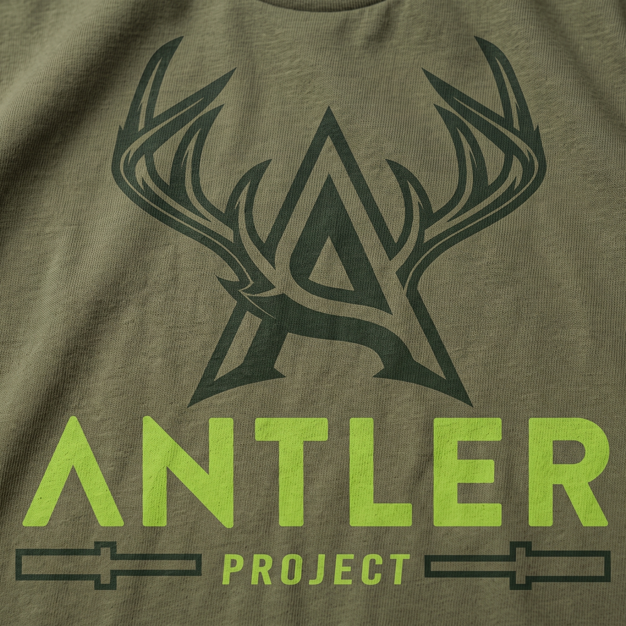 Antler Project screen print logo detail on green garment with antler A mark and project wordmark