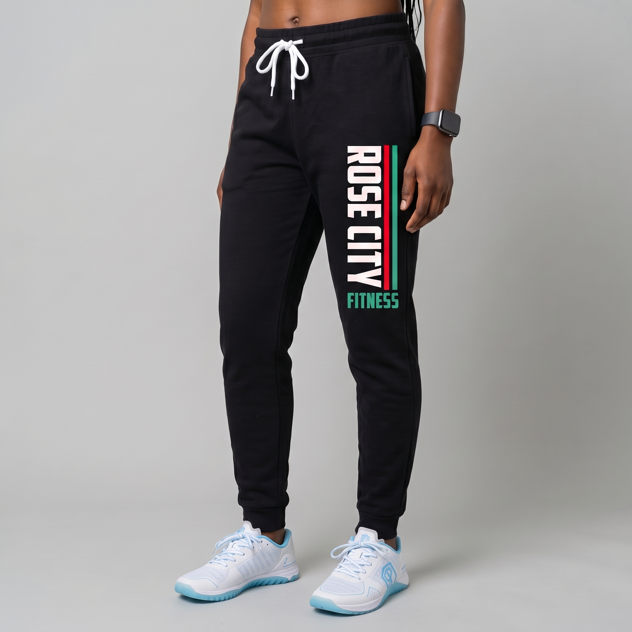 Black Rose City Community Fitness joggers with vertical leg print in white, red, and green