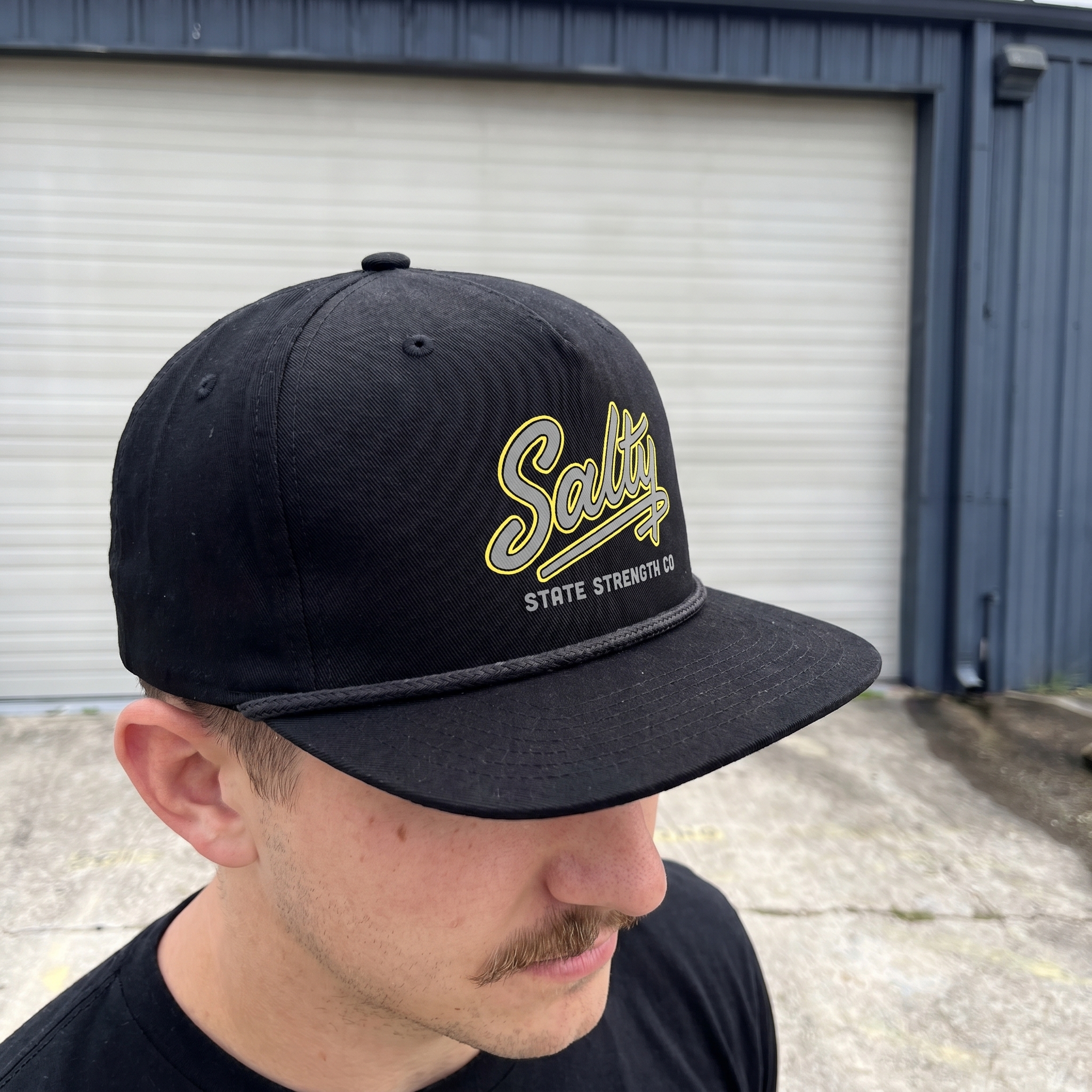 Black Salty State Strength Co. rope cap with embroidered script logo and grey type