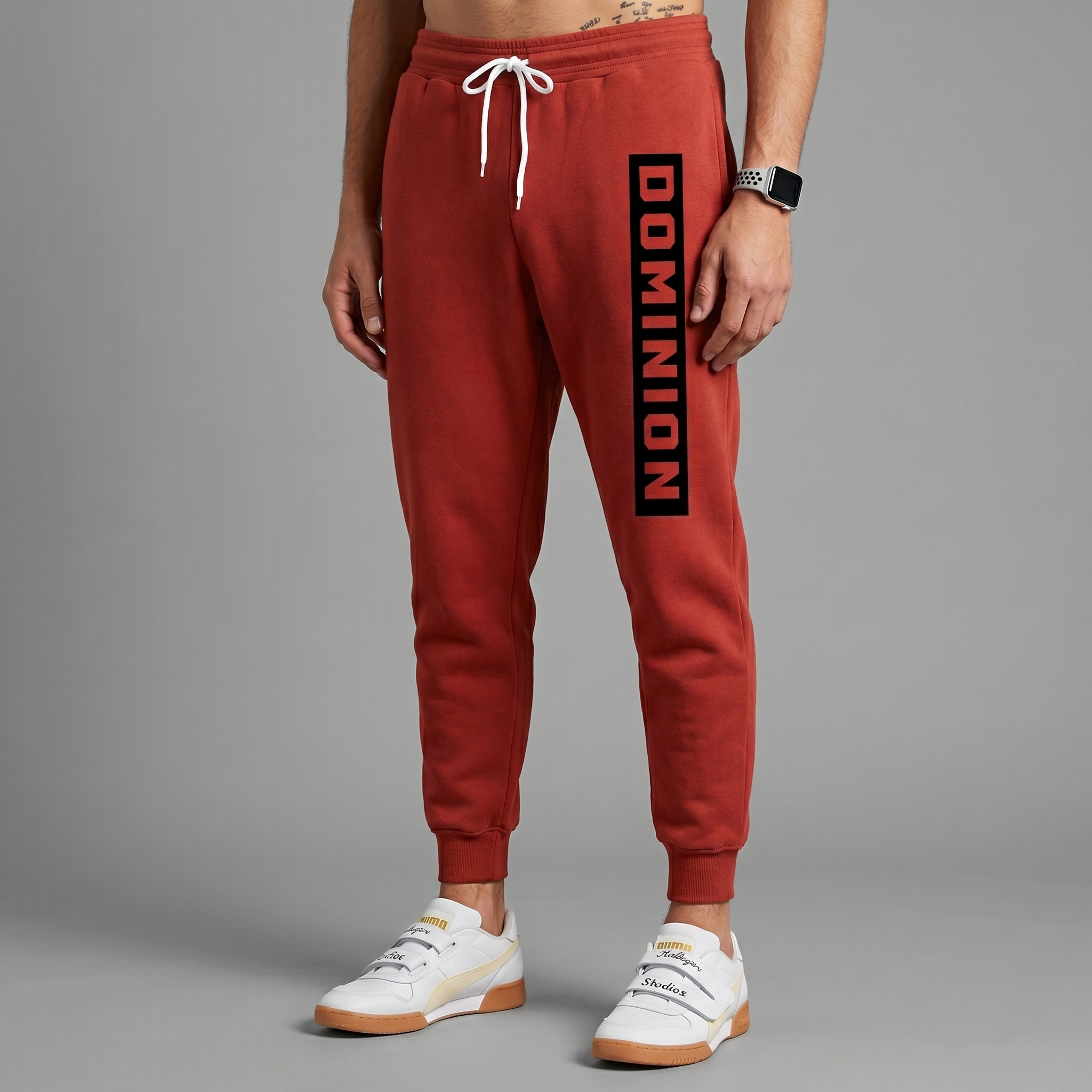 Red Dominion joggers with black vertical Dominion leg print