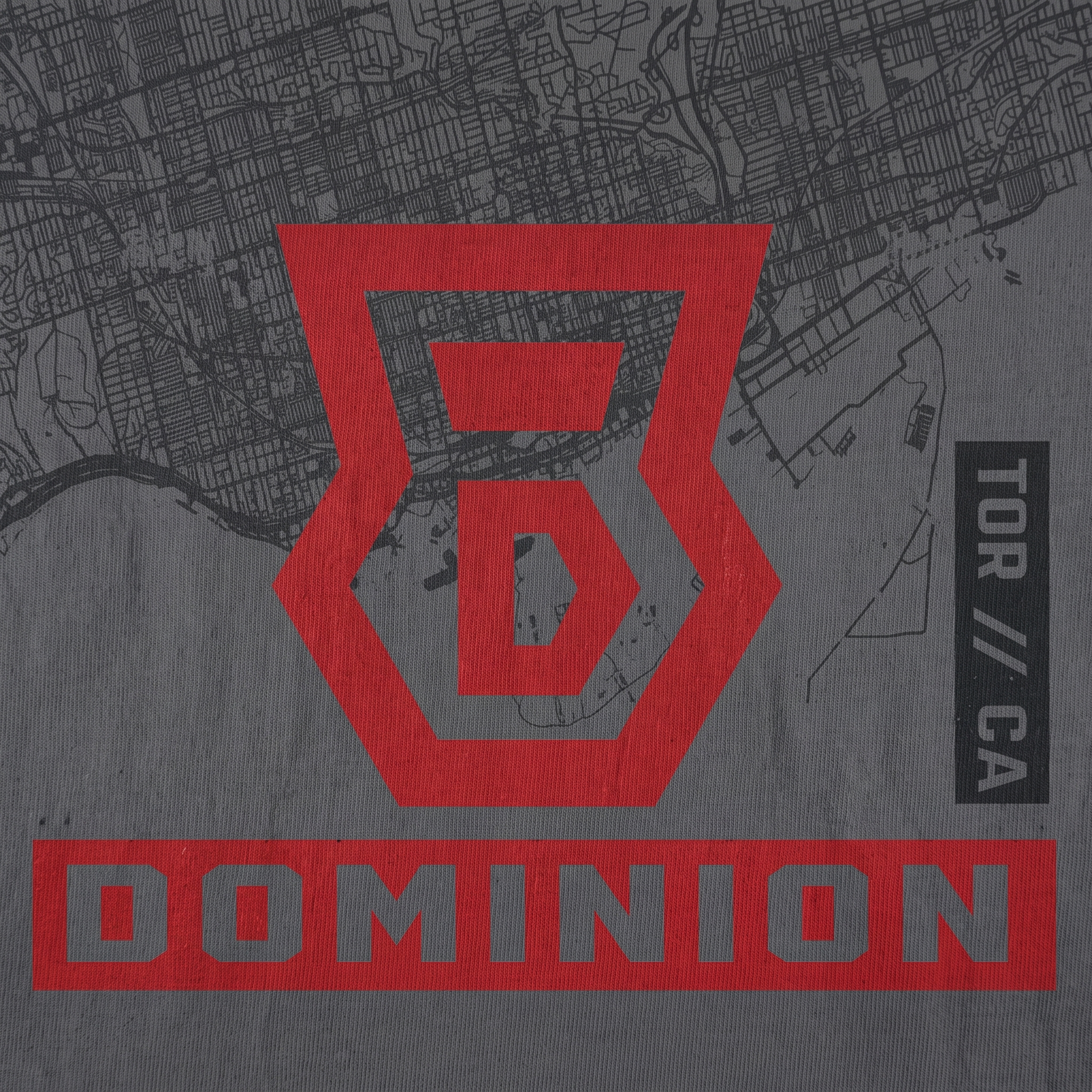 Dominion Toronto screen print logo detail with red shield monogram, map texture, Dominion wordmark, and TOR CA type