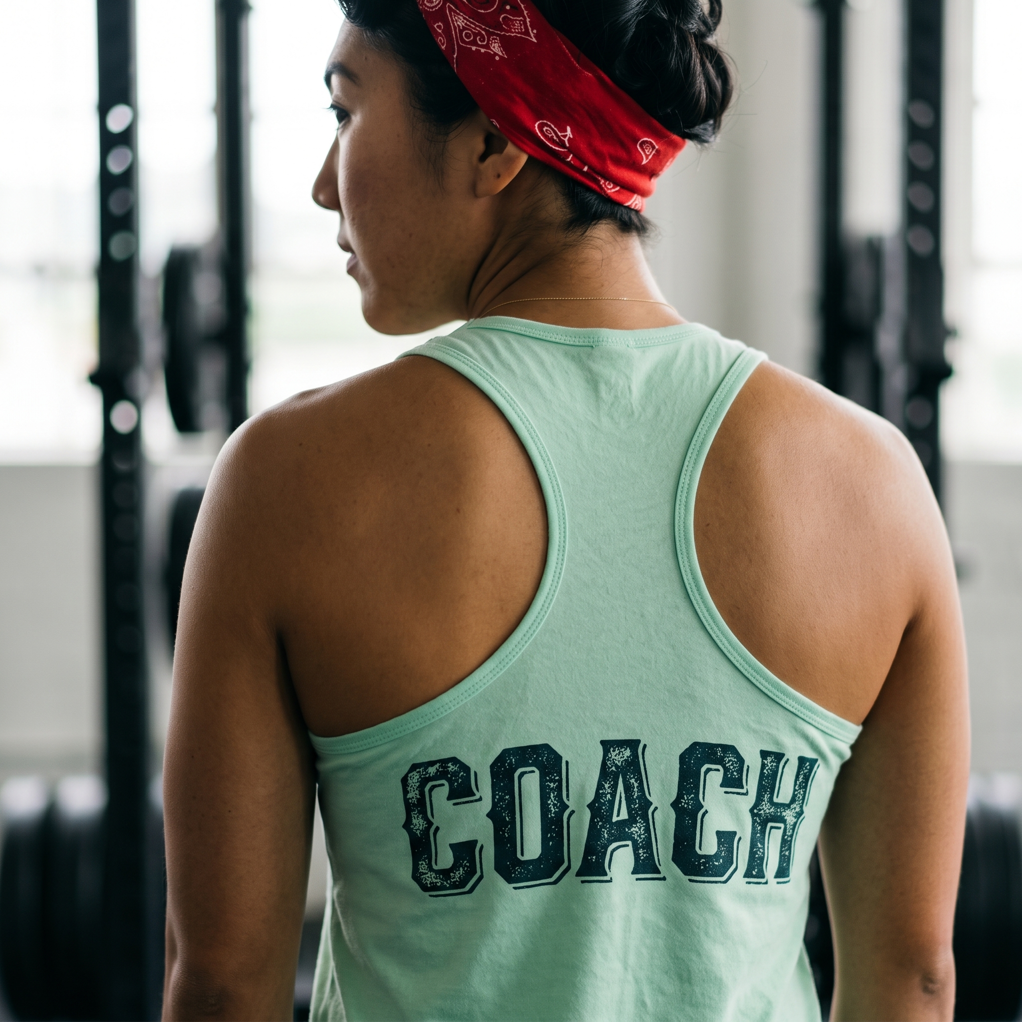 Back of mint Federal Barbell Co. coach racerback tank with distressed navy coach lettering