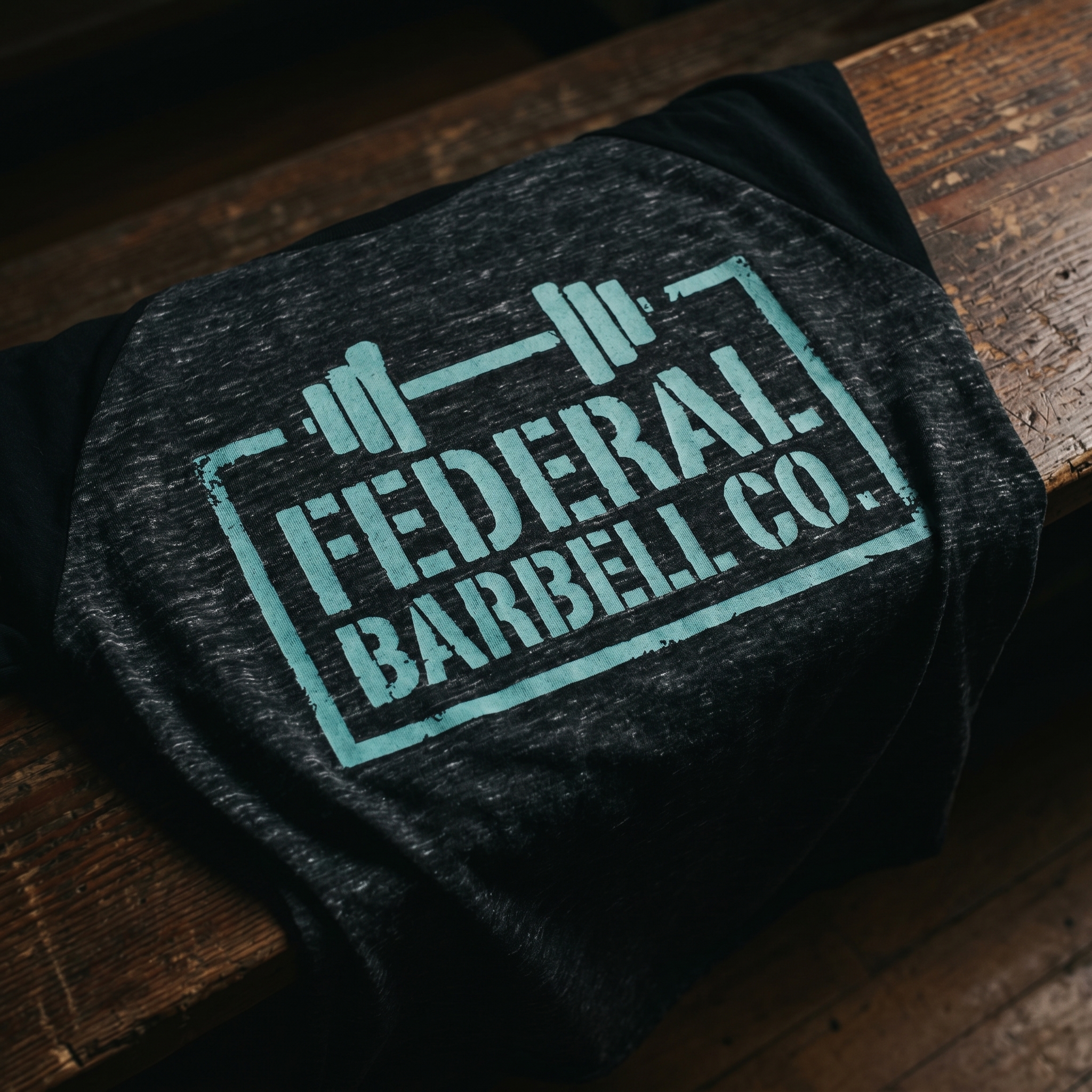 Federal Barbell Co. raglan shirt with mint boxed barbell logo on heather black body