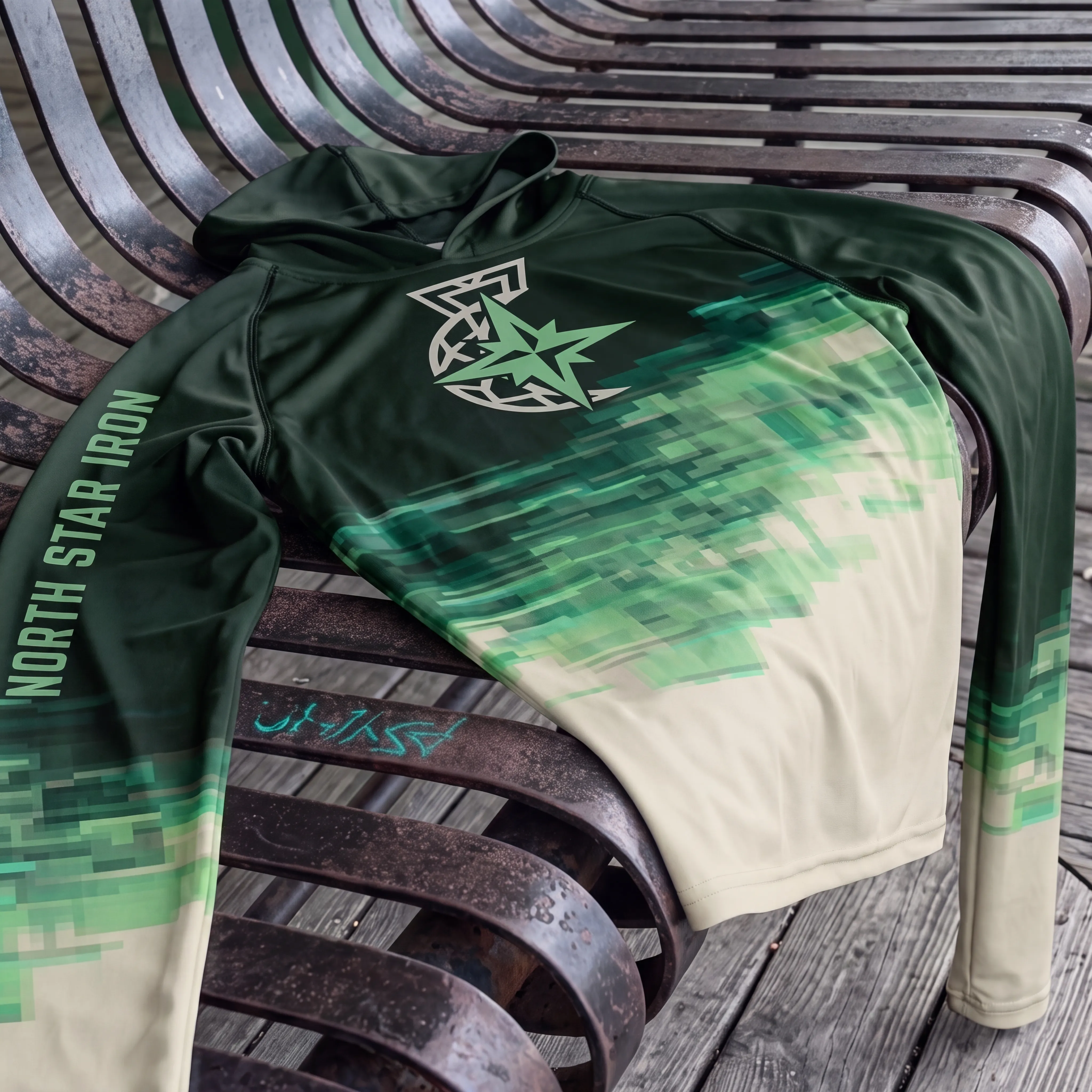 North Star Iron long sleeve performance hoodie with green skyline fade and star logo