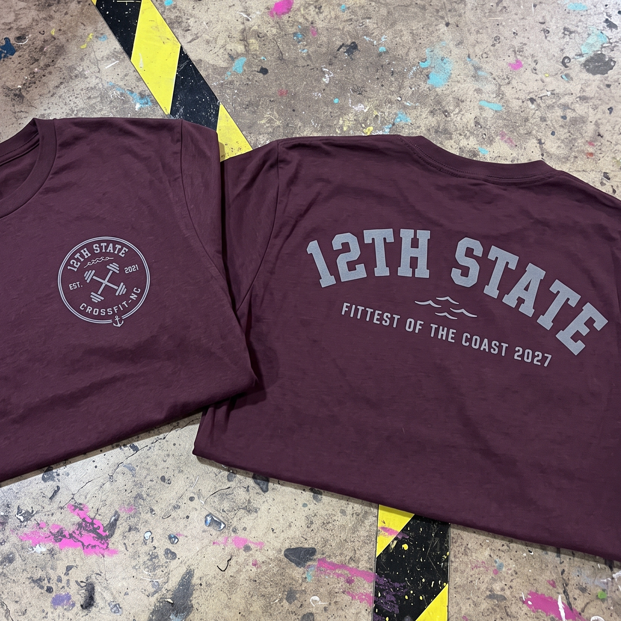 Burgundy 12th State CrossFit competition tees with collegiate lettering and barbell badge prints.
