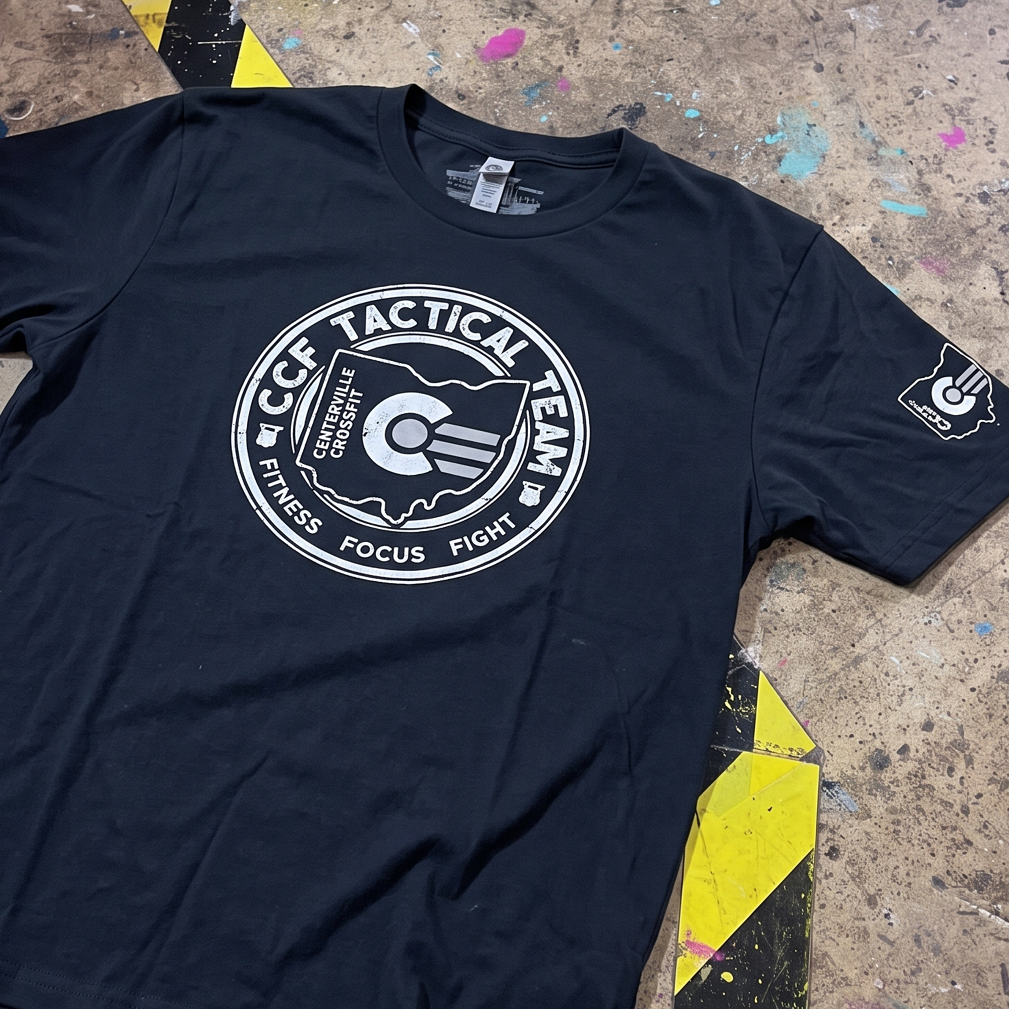 Black tee with distressed white Centerville CrossFit Tactical Team Ohio chest graphic and sleeve logo.