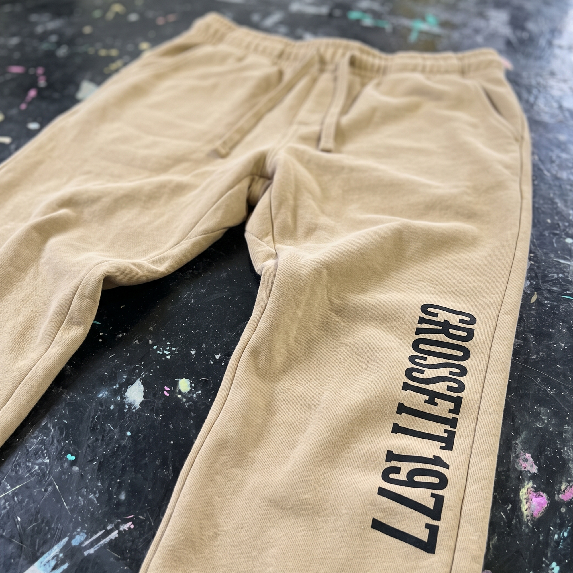 Sand joggers with vertical CrossFit 1977 print on the leg.