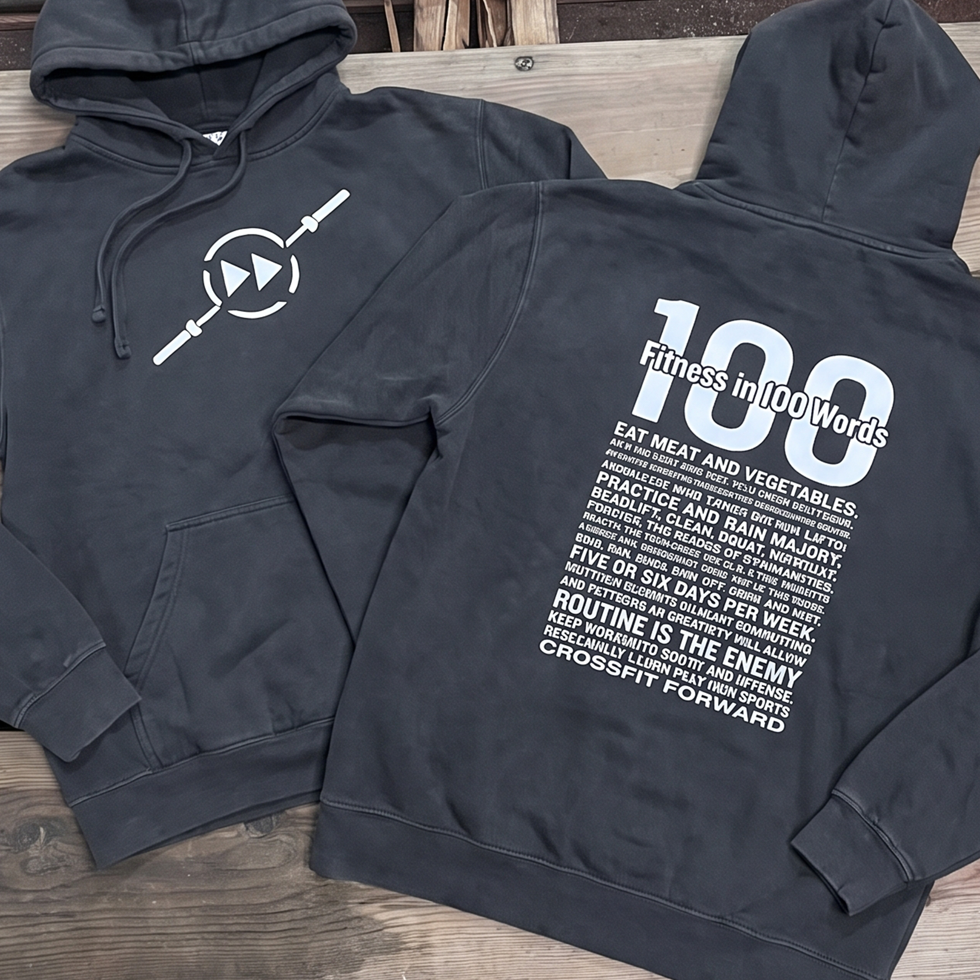 Charcoal hoodies with white barbell-smiley chest print and Fitness in 100 Words back print.