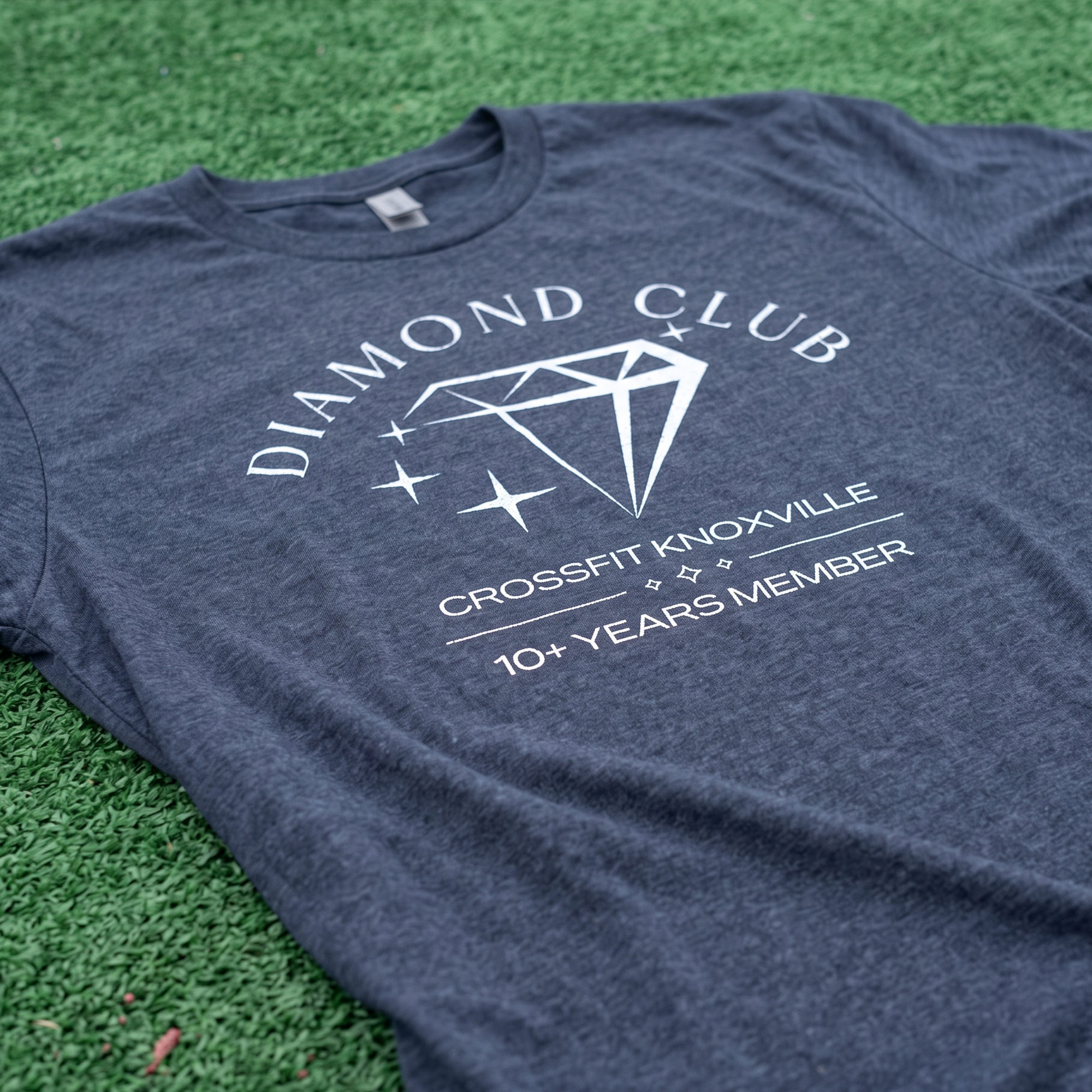 Heather navy T-shirt with white diamond graphic and 10+ years member text for CrossFit Knoxville.
