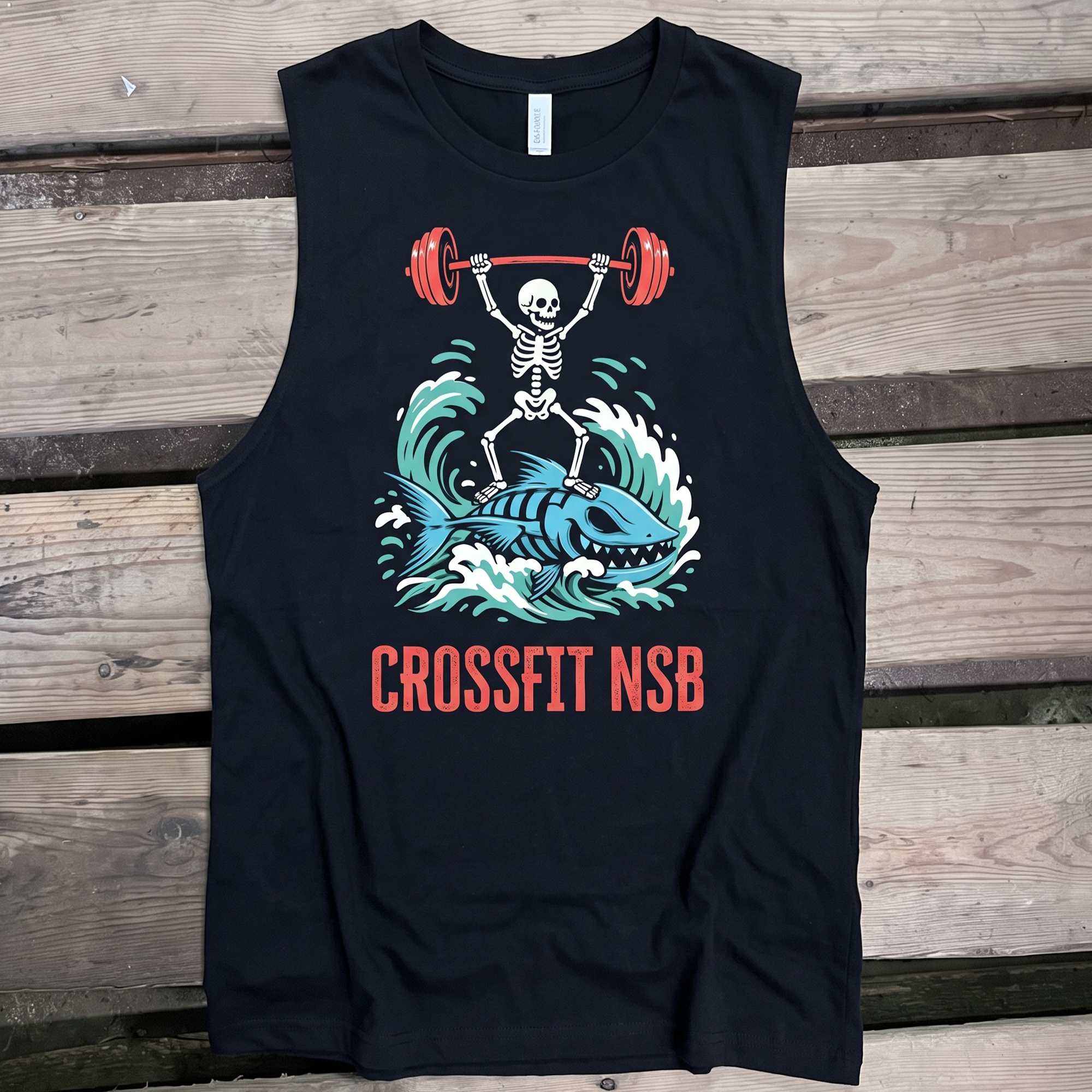 Black tank with skeleton lifting a barbell while riding a shark graphic and CrossFit NSB text.