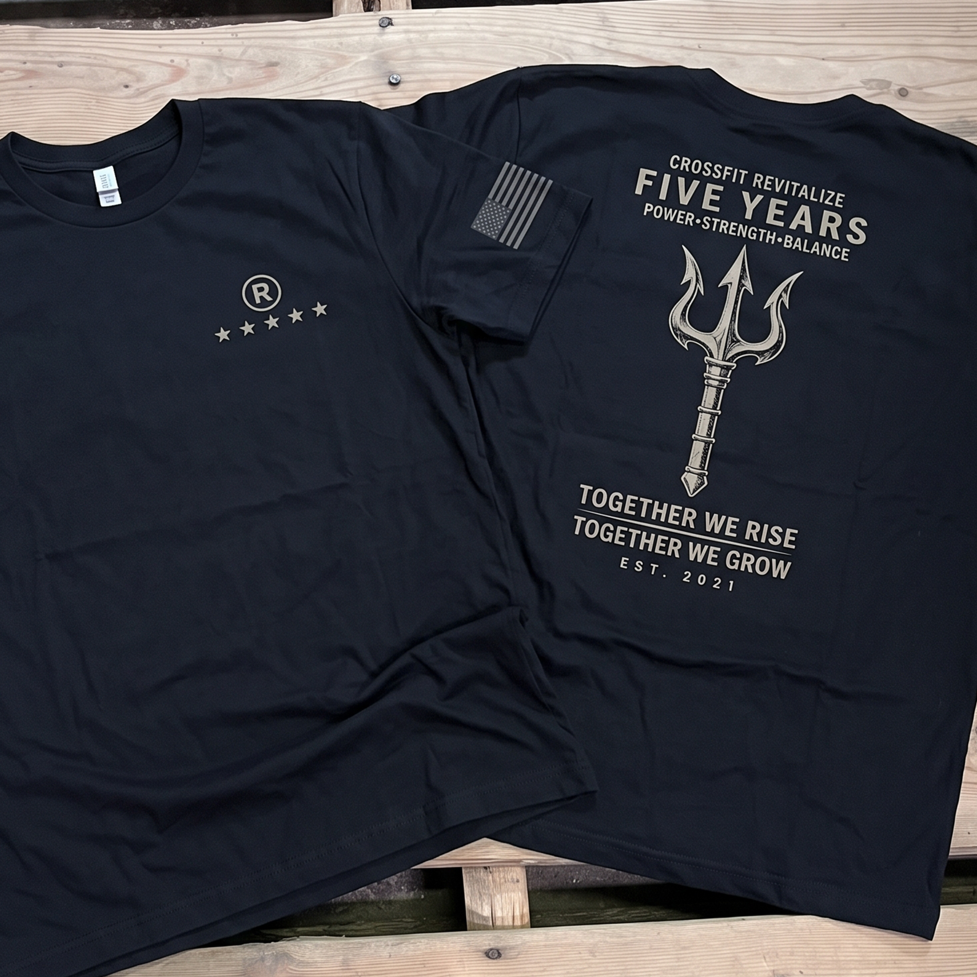 Black CrossFit Revitalize five-year anniversary tees with trident back graphic, front chest logo, and American flag sleeve print.