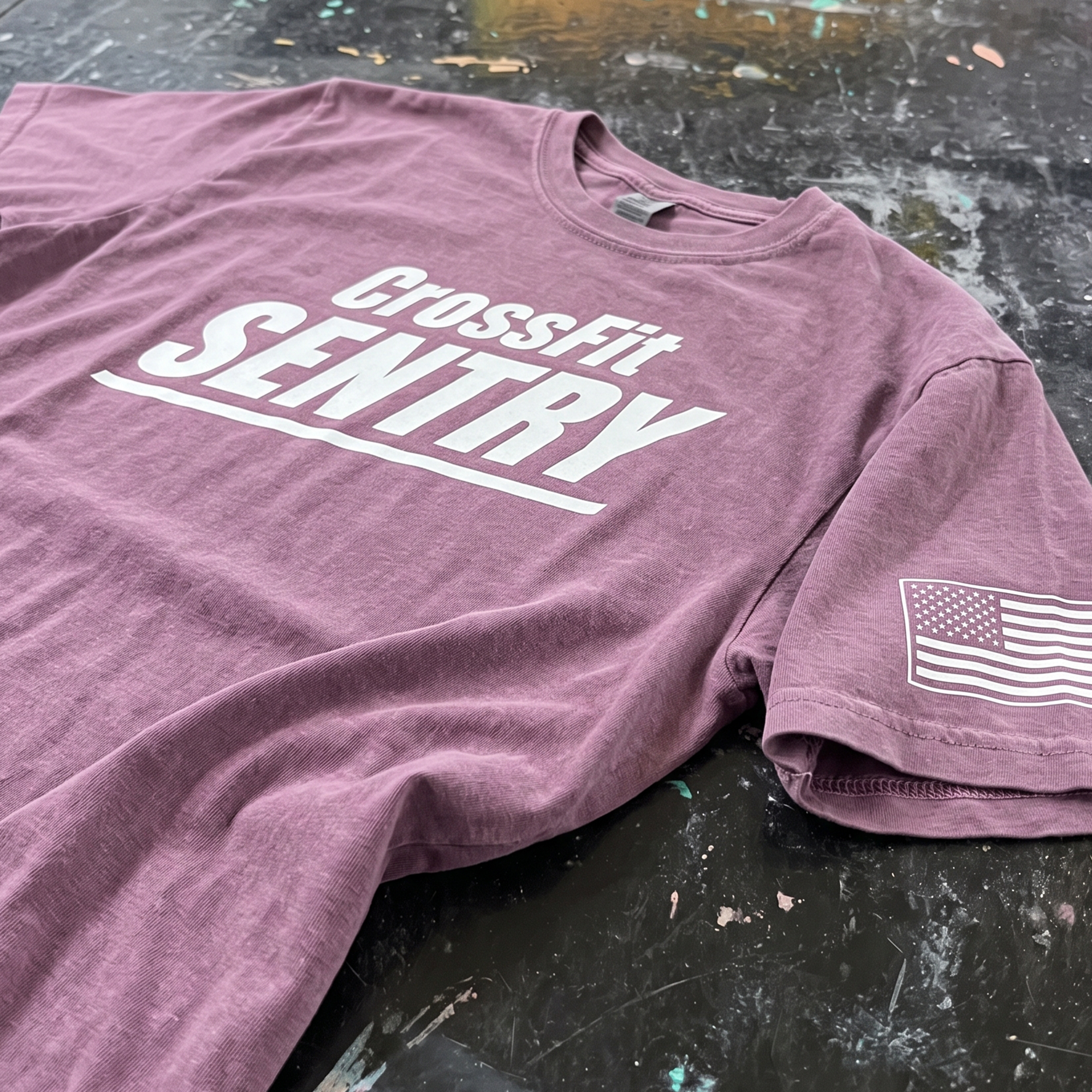Muted mauve CrossFit Sentry T-shirt with white chest lettering and American flag sleeve print.