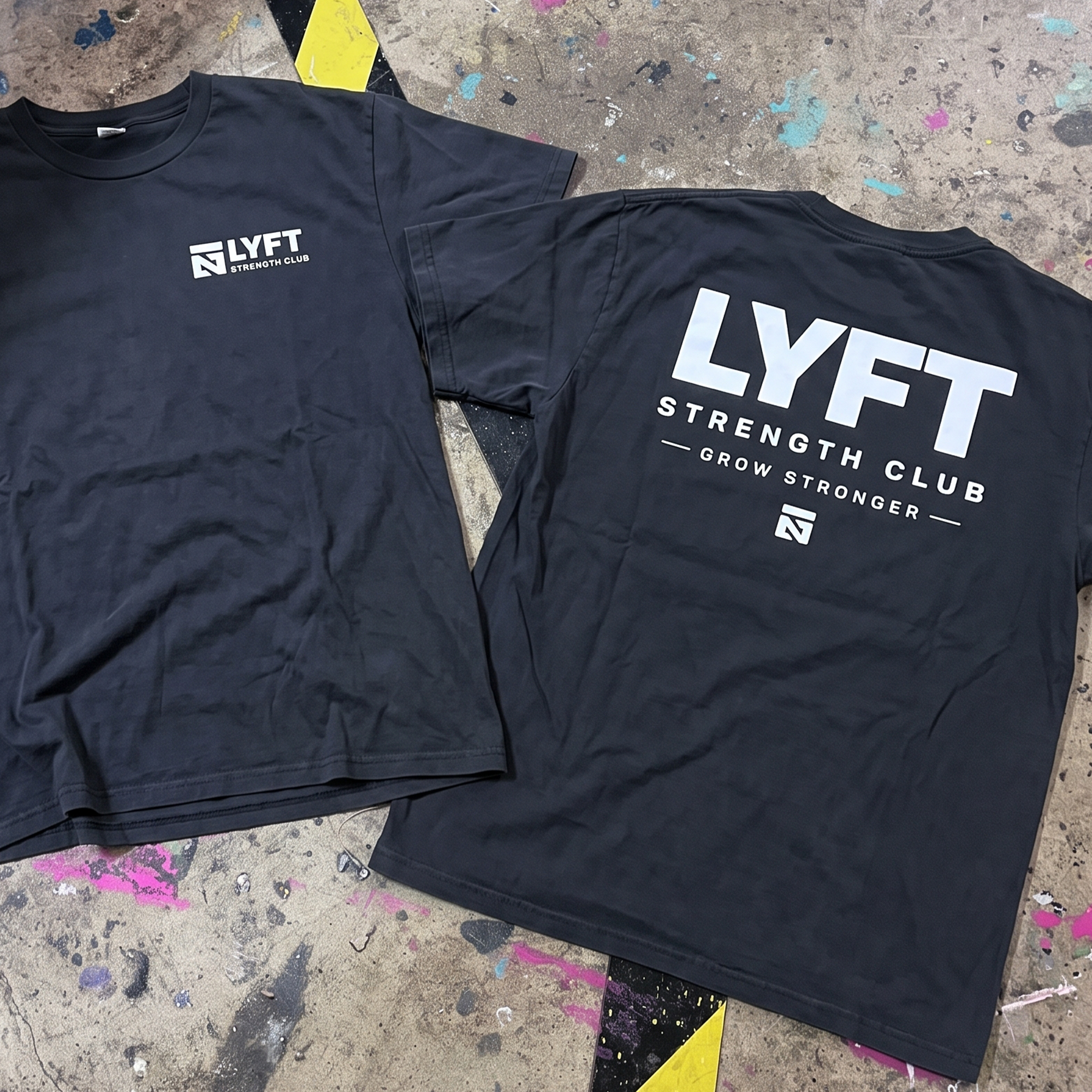 Black LYFT Strength Club tees with small white chest logo and oversized white back print.
