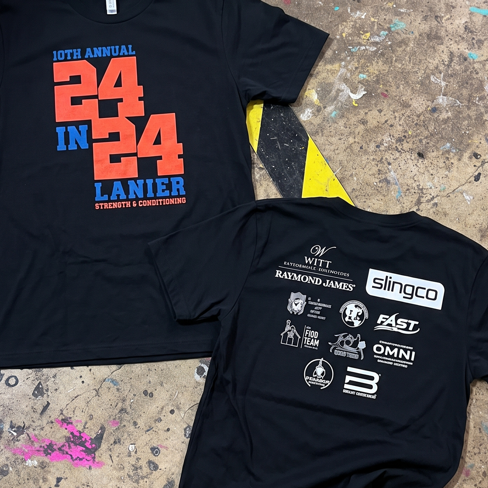 Black fundraiser T-shirts with coral and blue 24 in 24 front print and white sponsor logos on the back.