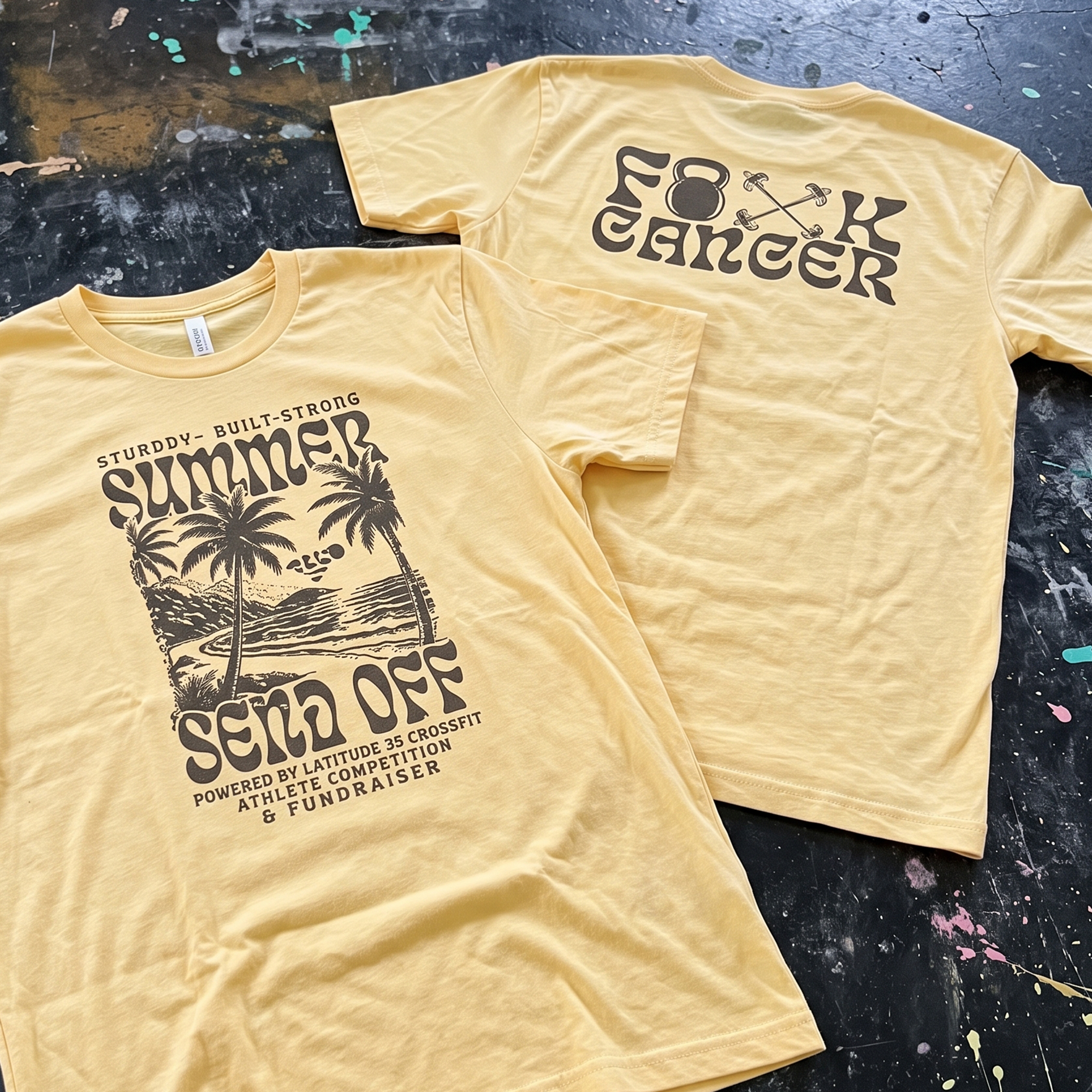 Yellow fundraiser T-shirts with brown retro graphics, palm trees, beach illustration, and kettlebell barbell back print.