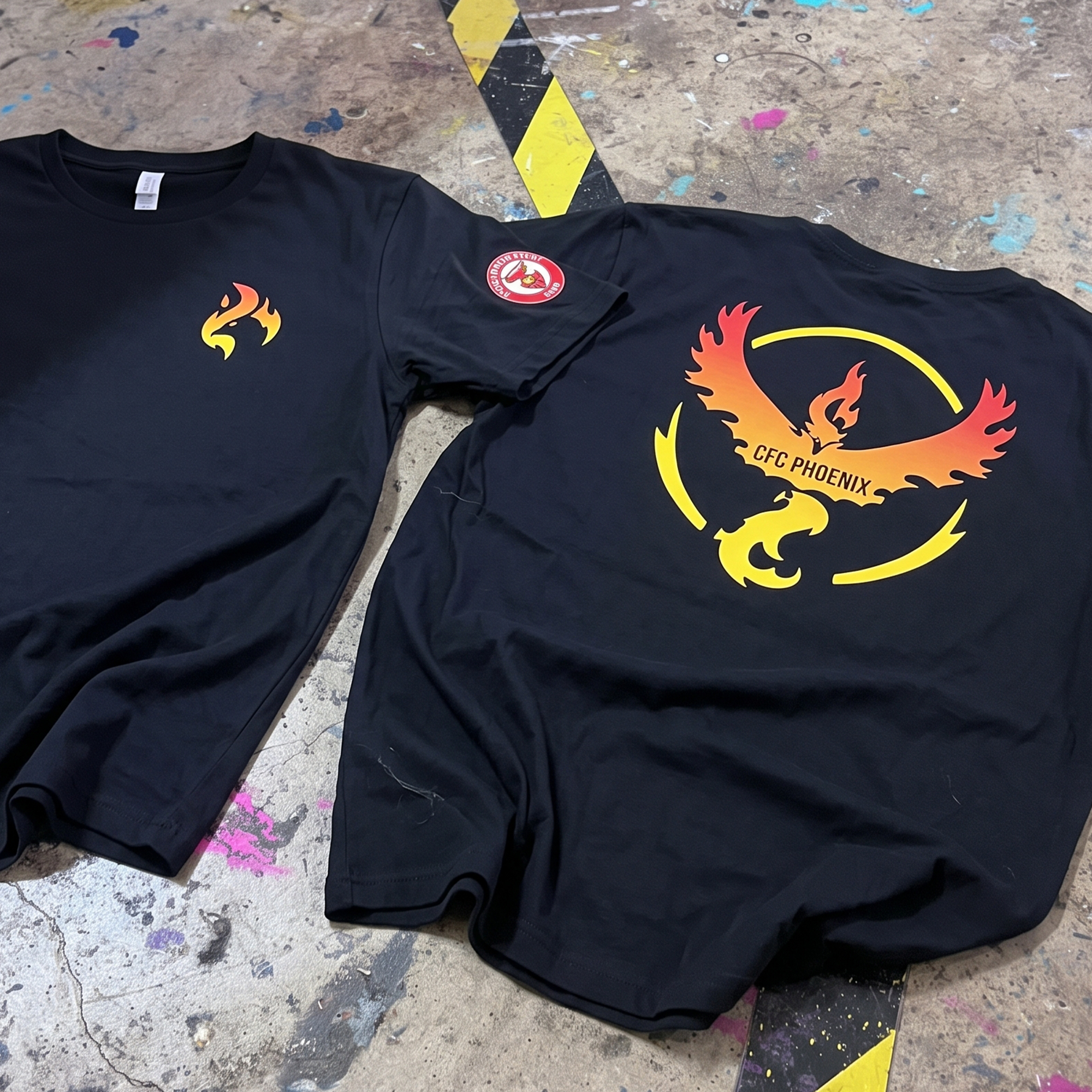 Black T-shirts with yellow-to-red phoenix graphics and CFC Phoenix back print.