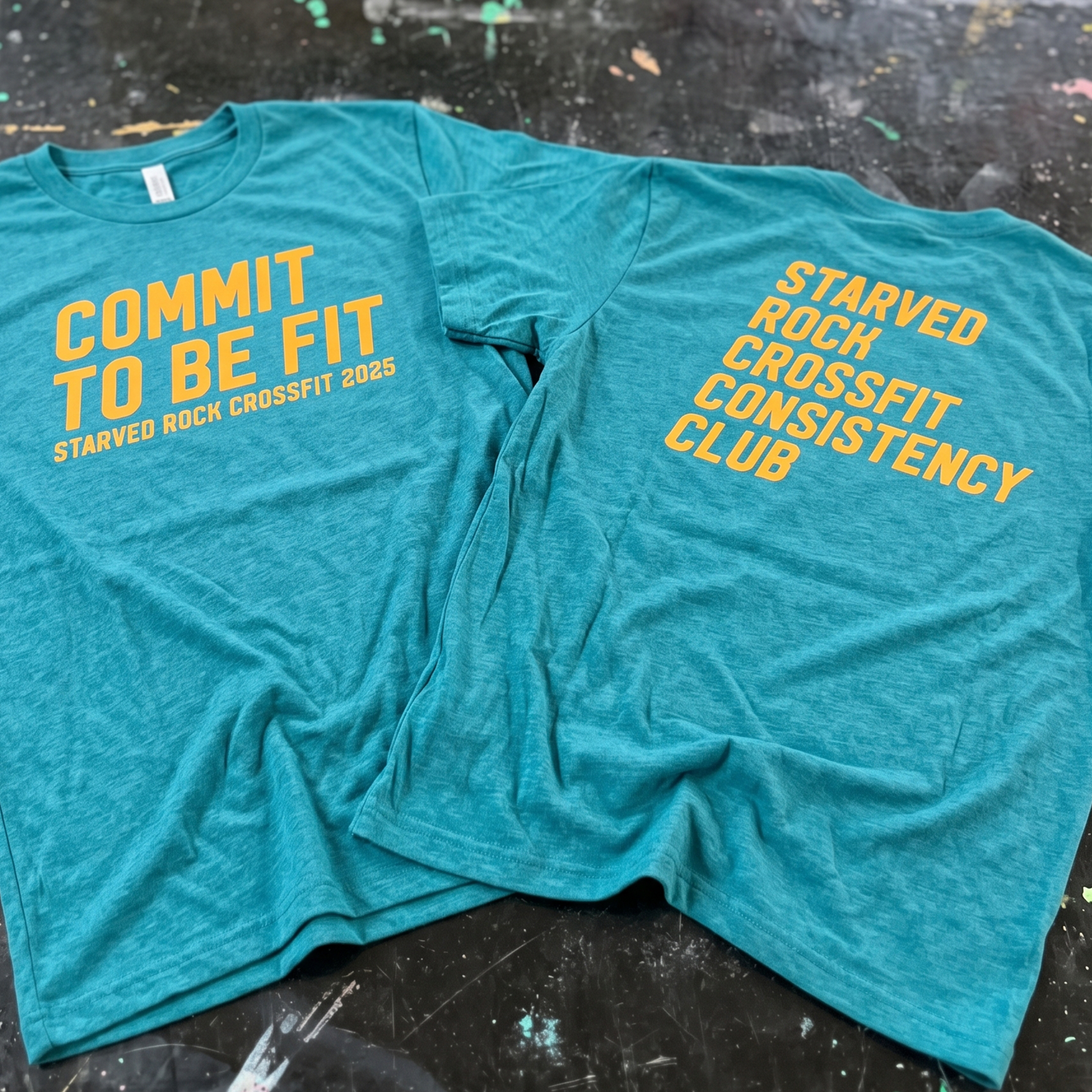 Teal T-shirt with yellow Starved Rock CrossFit Consistency Club front and back prints.
