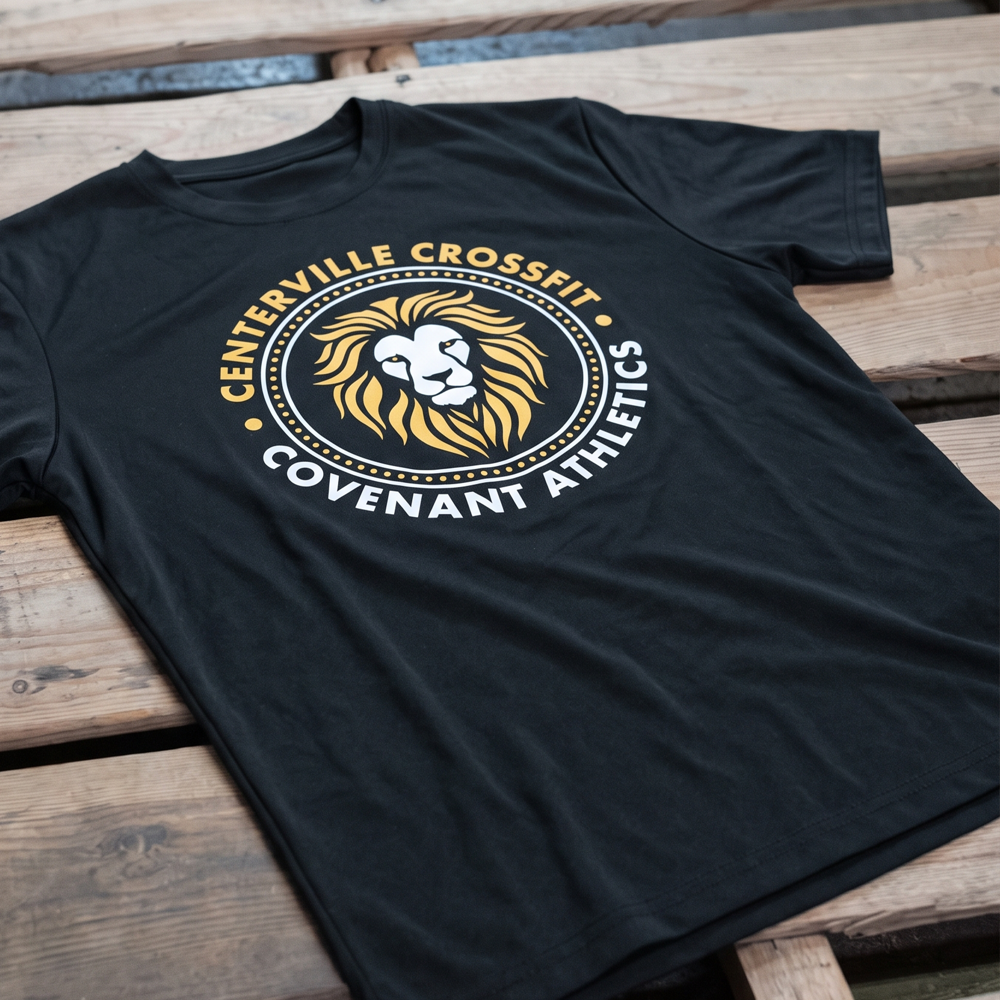 Black Centerville CrossFit Covenant Athletics tee with a gold and white lion crest.