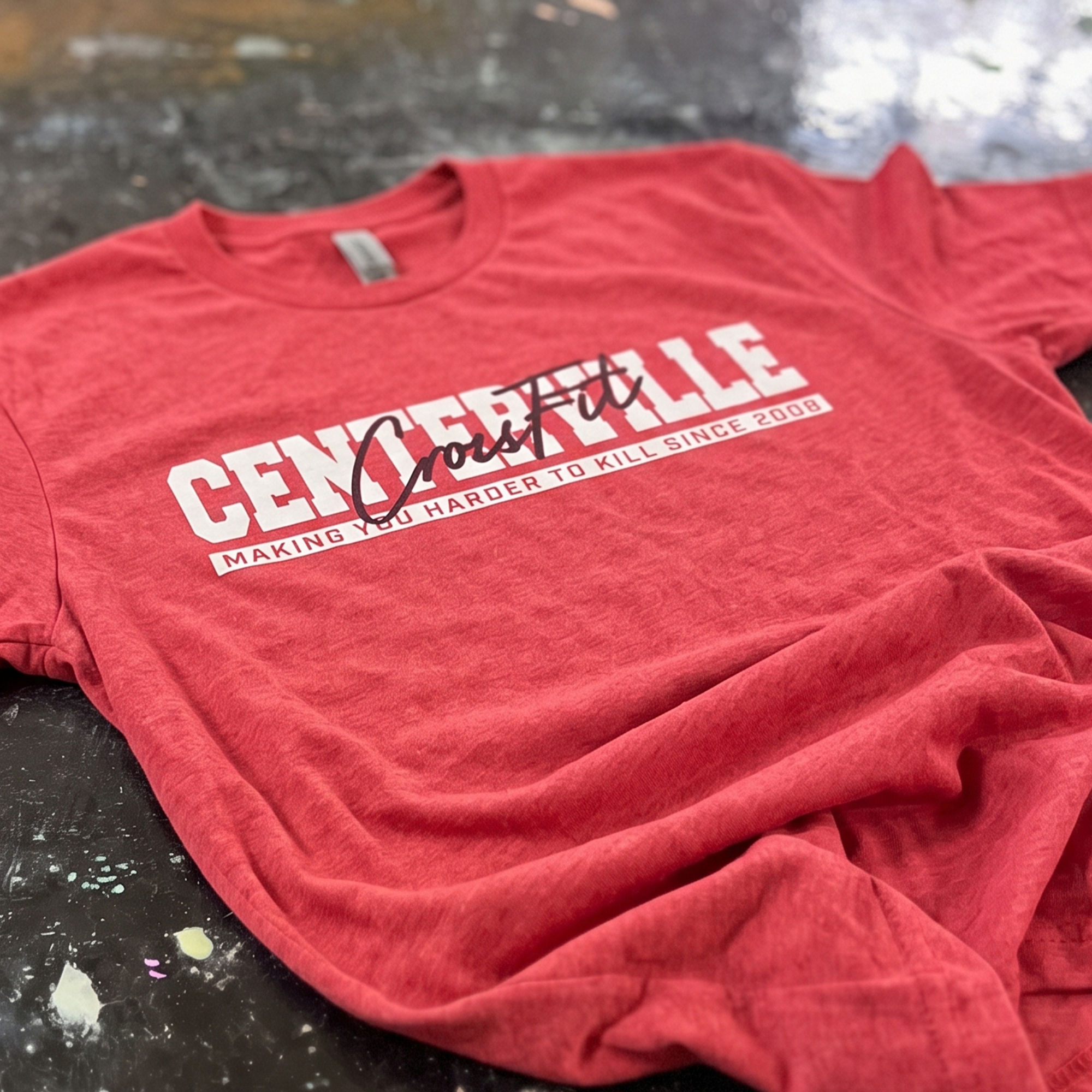 Red Centerville CrossFit tee with white collegiate lettering and black script.