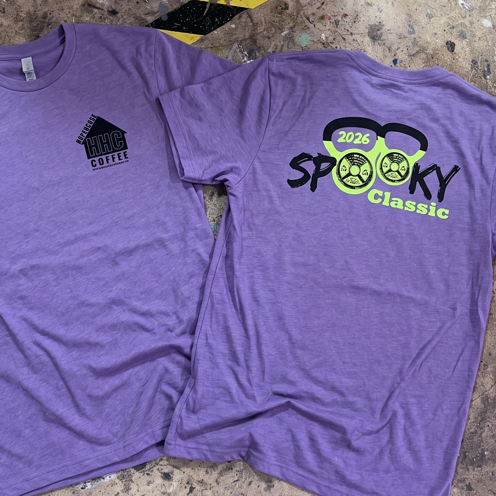 Purple T-shirts with black chest logos and neon green Spooky Classic kettlebell print.