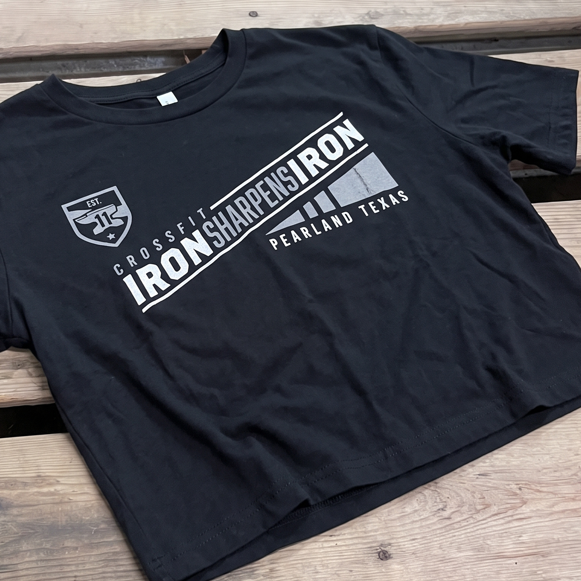 Black tee with silver-gray diagonal CrossFit Iron Sharpens Iron graphic