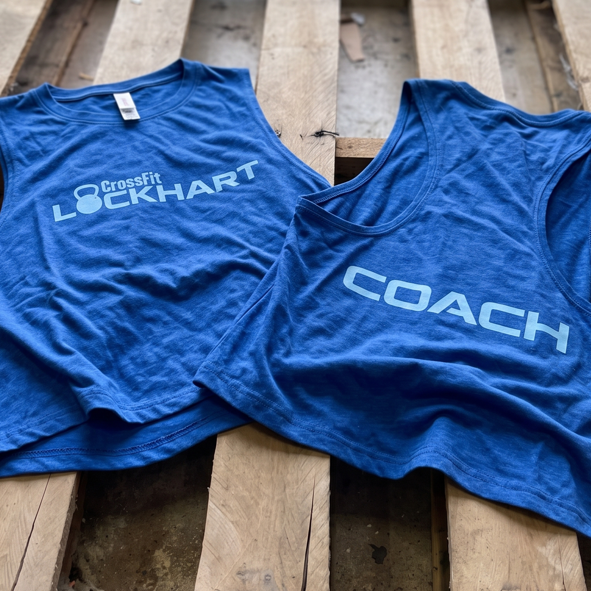 Blue CrossFit Lockhart tanks with light blue front and back prints