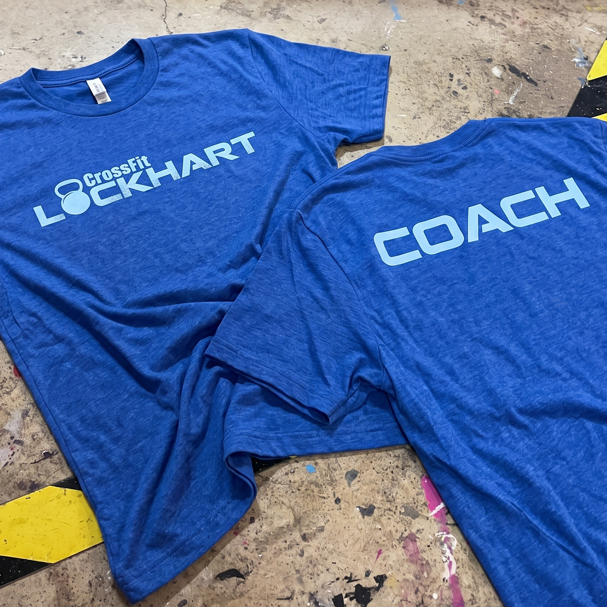 Blue CrossFit Lockhart tees with light blue front logo and back coach print