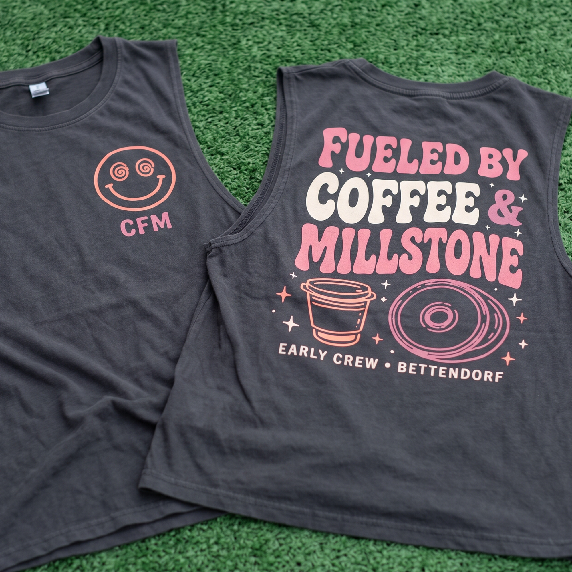 Black tank with CFM chest mark and pink Fueled By Coffee & Millstone back print.