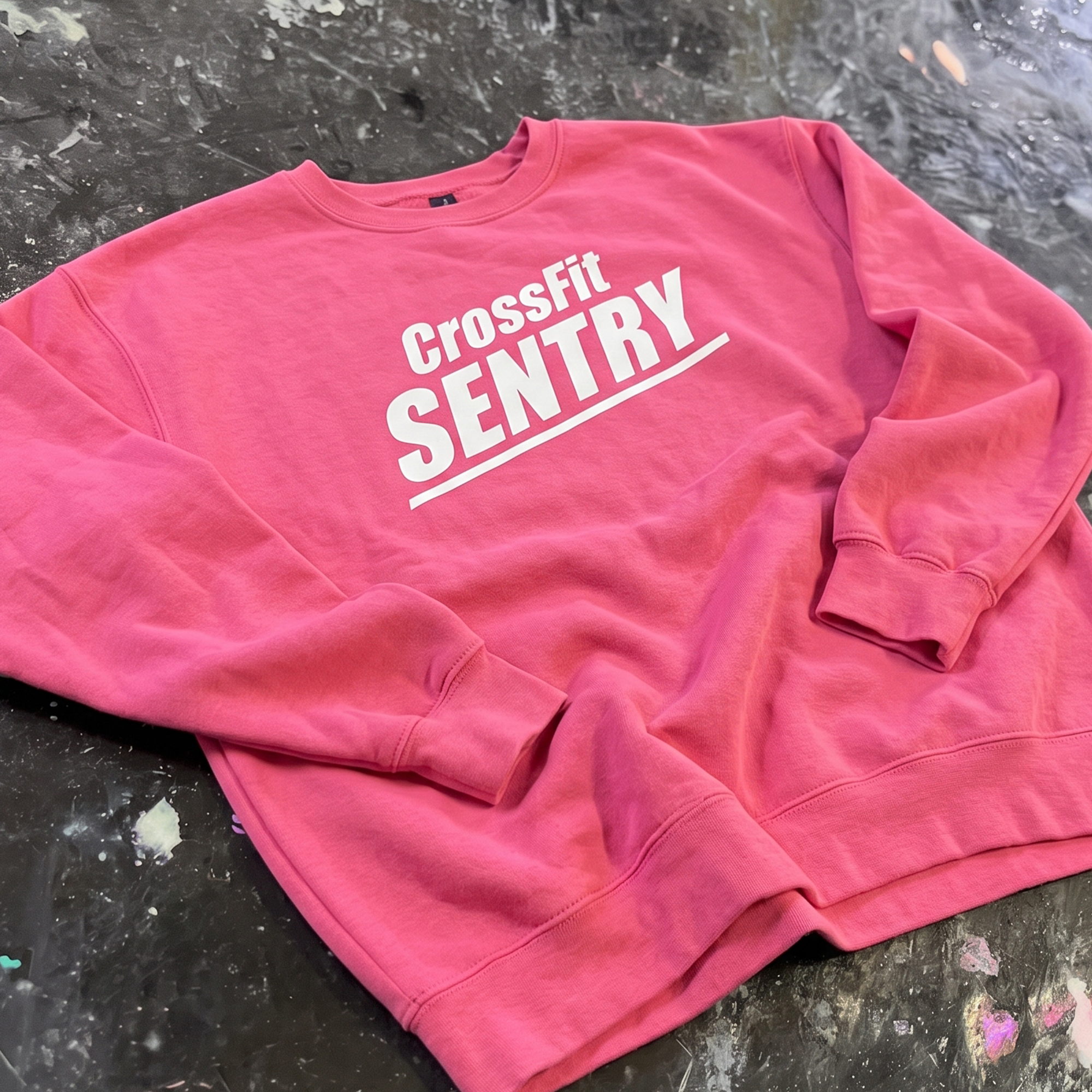 Pink crewneck with white CrossFit Sentry front print.