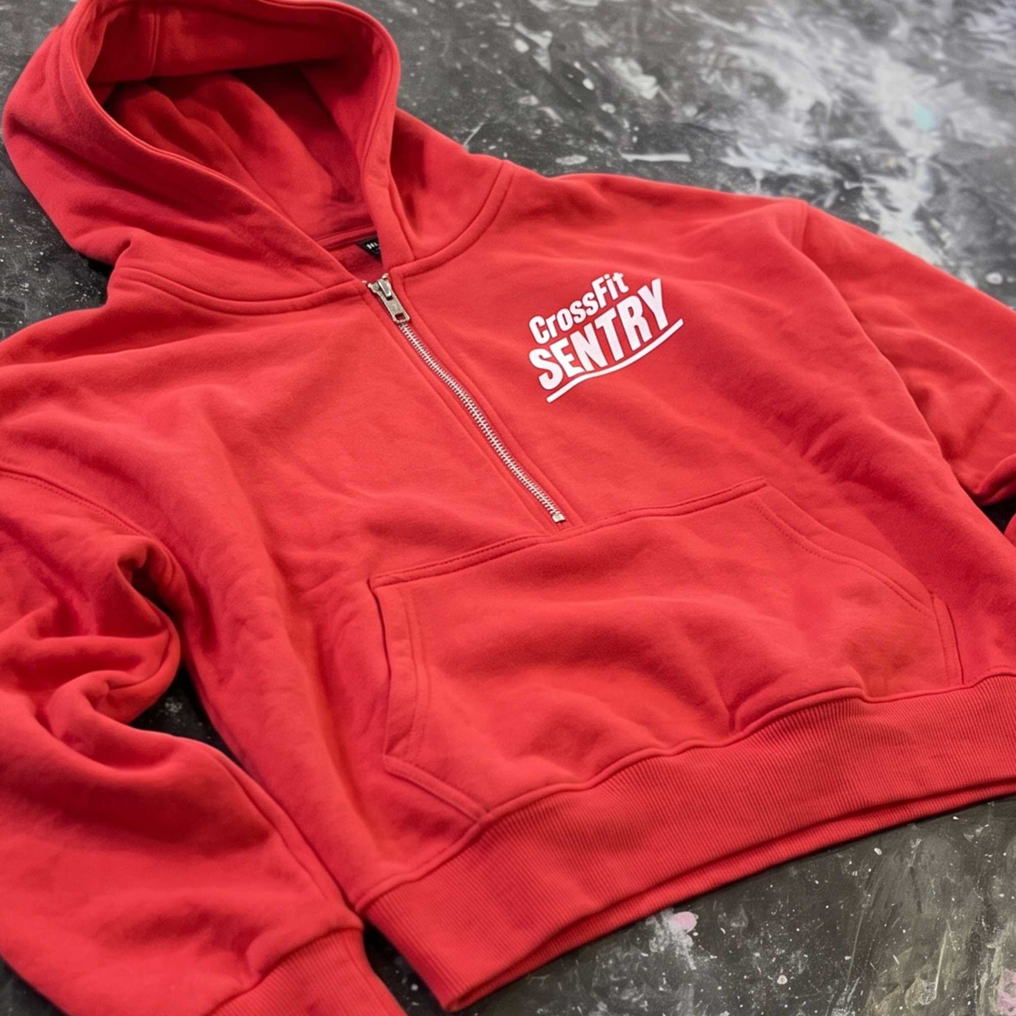 Red quarter-zip hoodie with white left-chest CrossFit Sentry print.