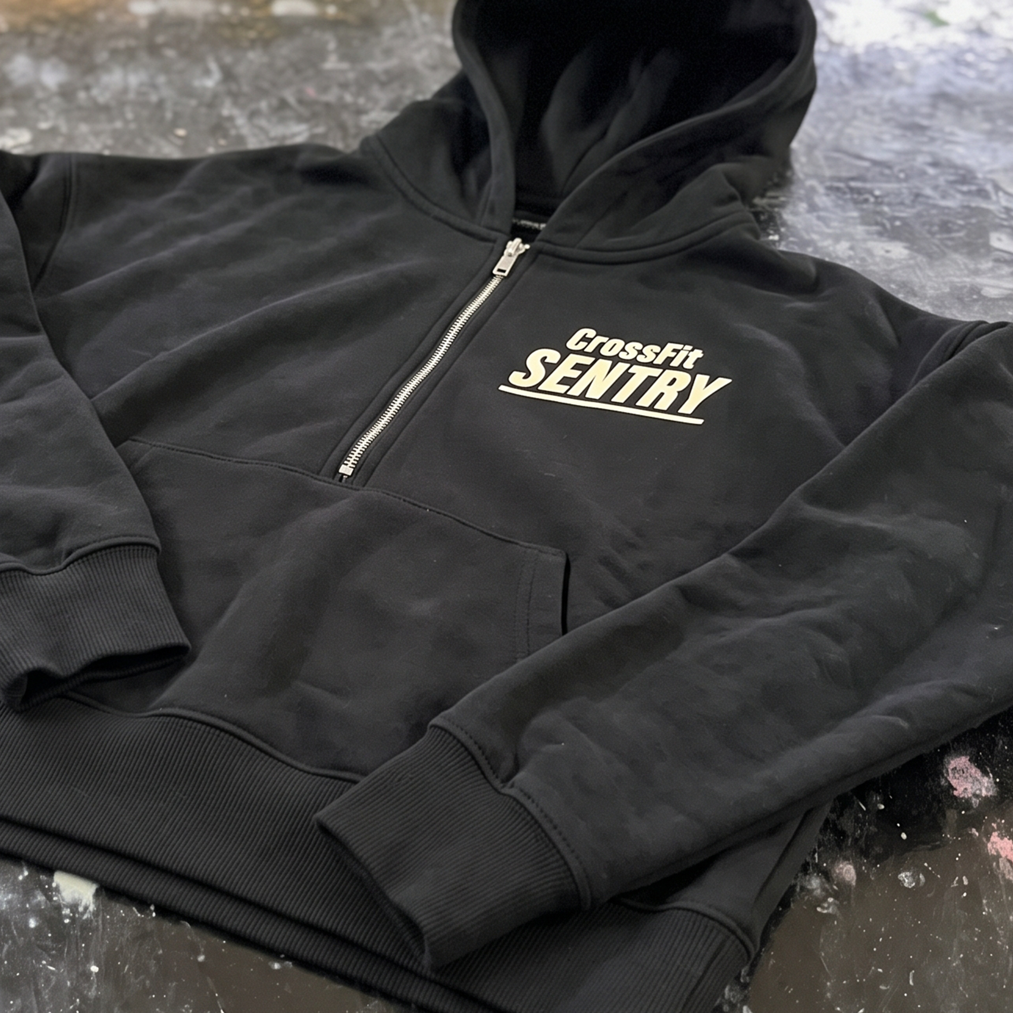 Black quarter-zip hoodie with cream left-chest CrossFit Sentry print.