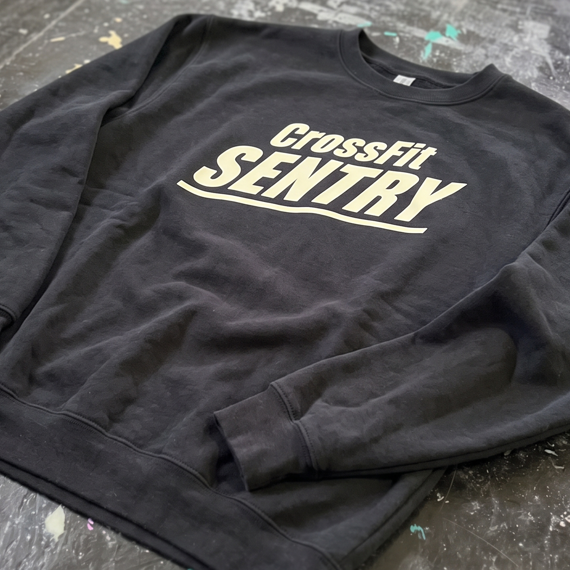 Black crewneck with cream CrossFit Sentry front print.