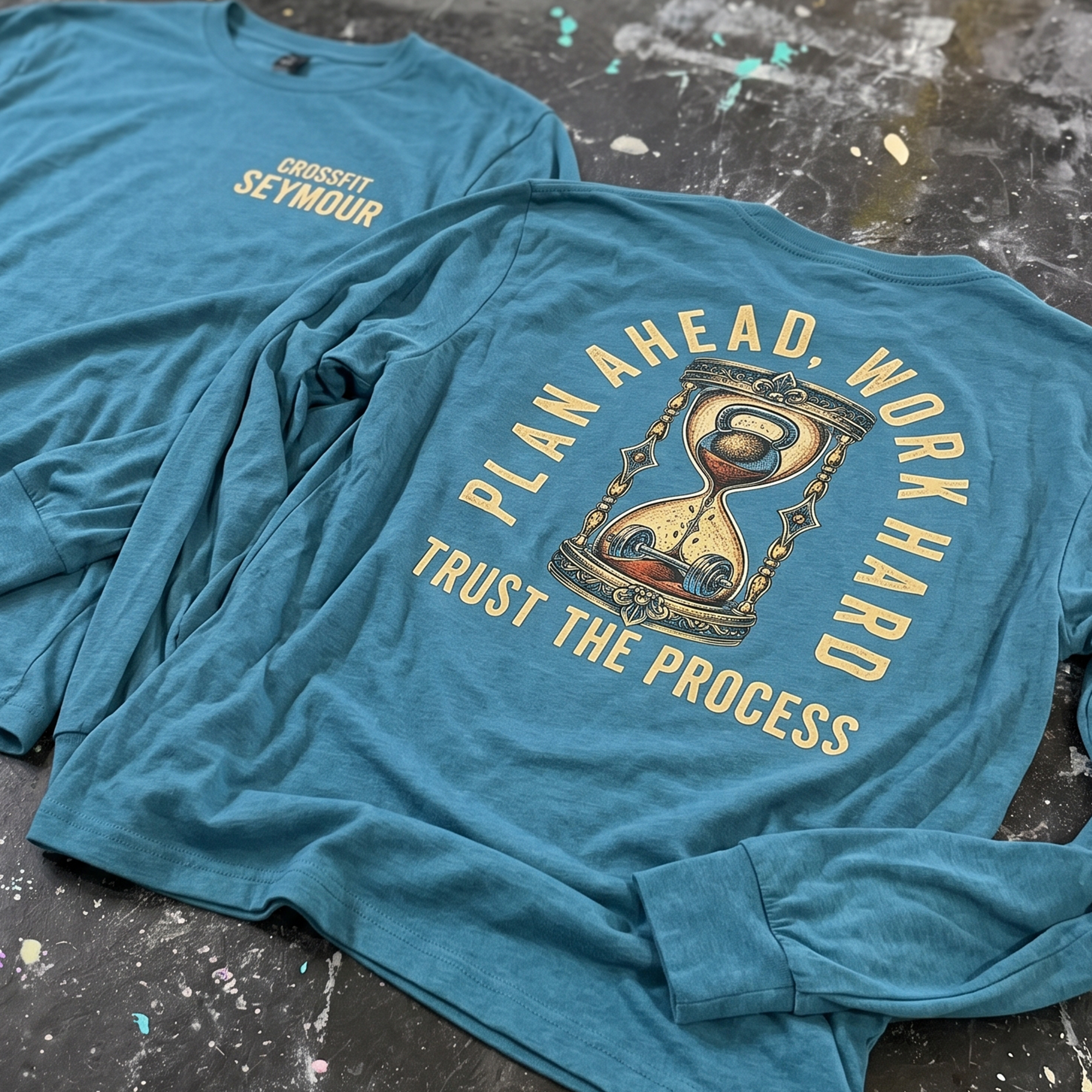Blue long-sleeve shirts with a small CrossFit Seymour chest print and large hourglass graphic.