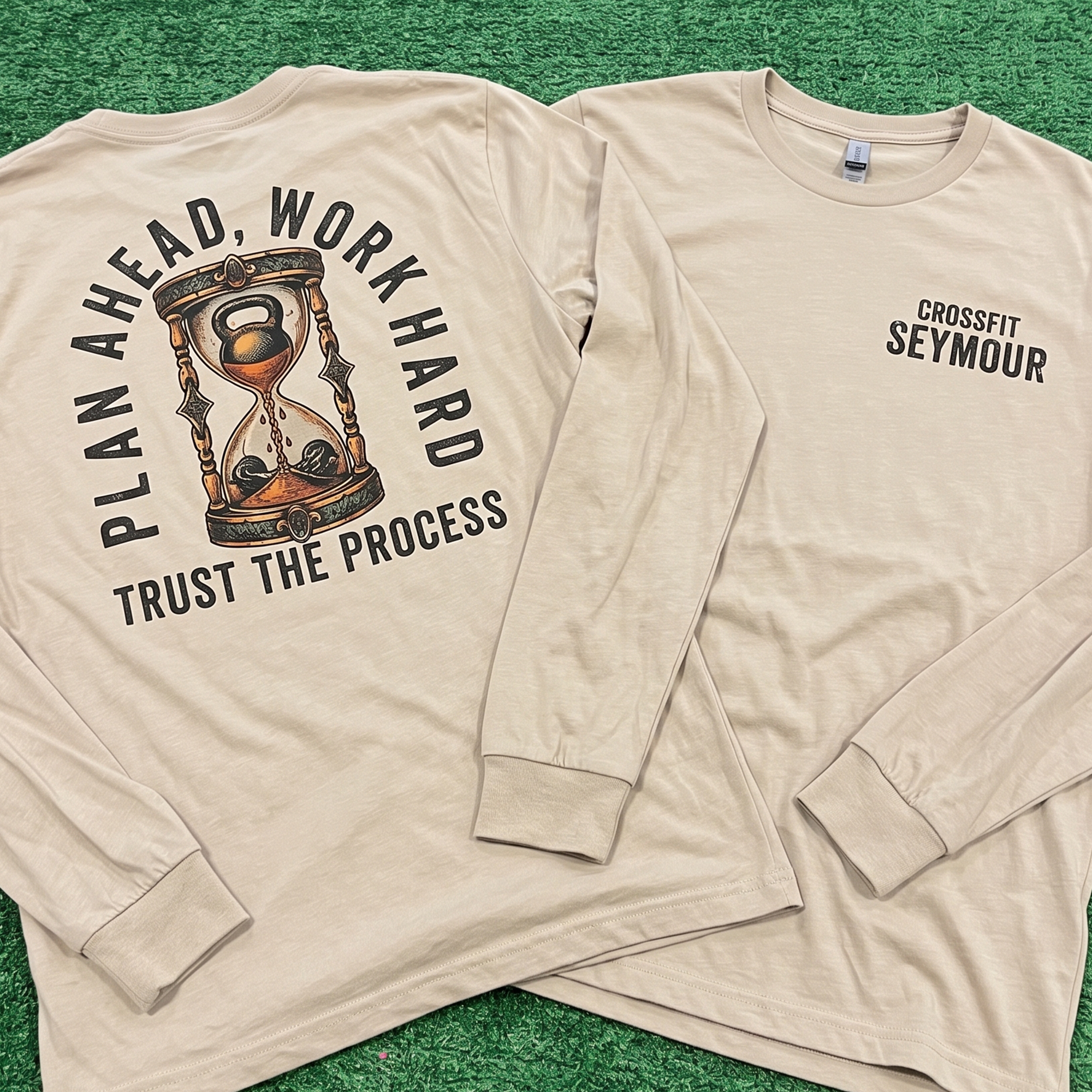 Cream long-sleeve shirts showing a large hourglass back print and CrossFit Seymour chest logo.