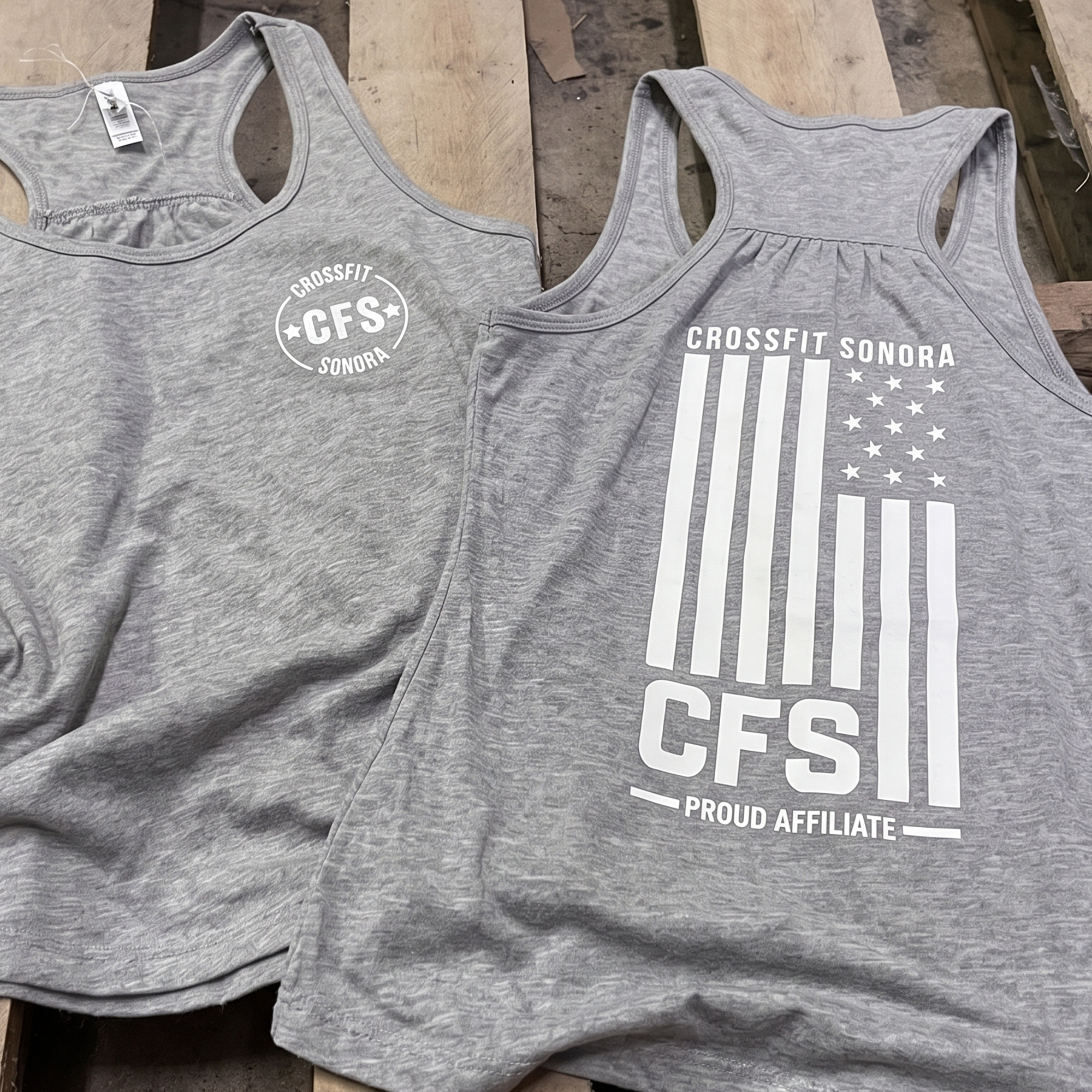 Gray racerback tanks with white chest logo and flag-inspired CFS print.