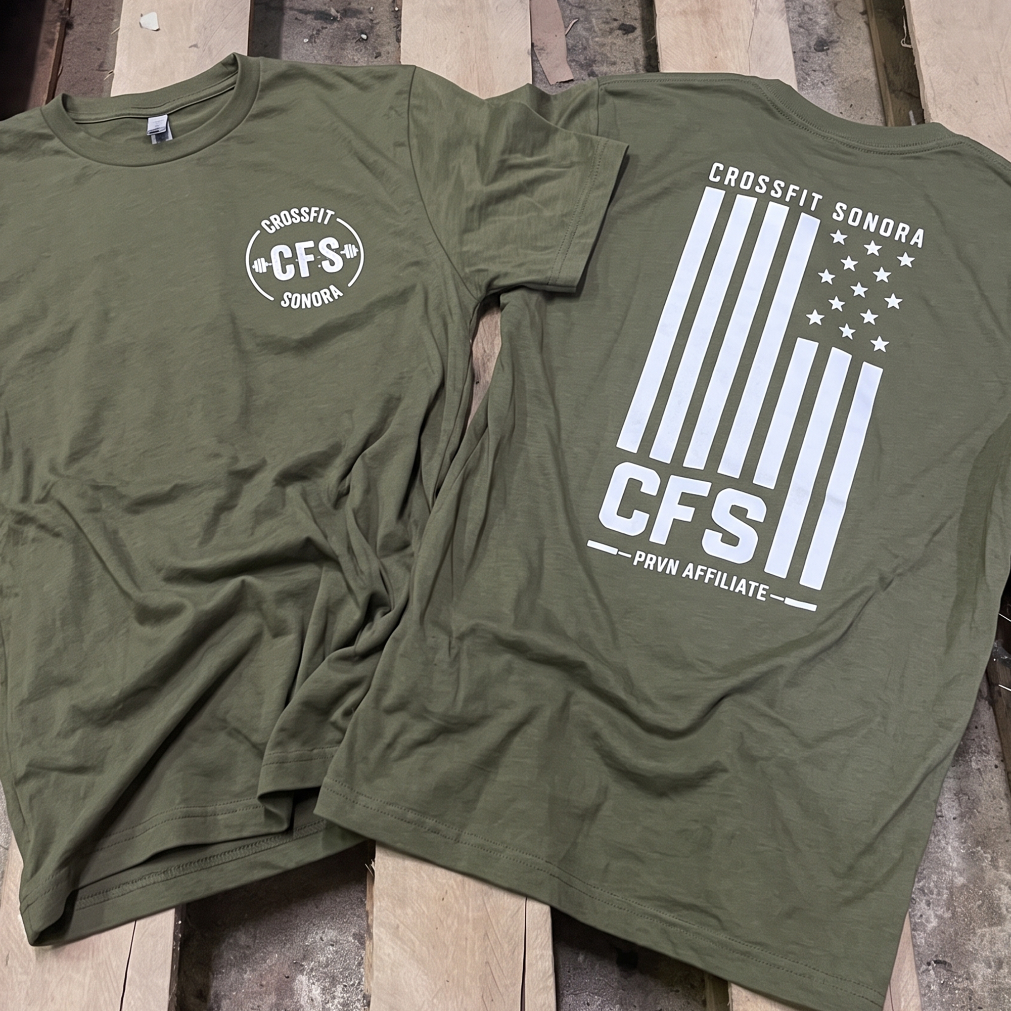 Olive tees with white chest logo and flag-inspired CFS back print.