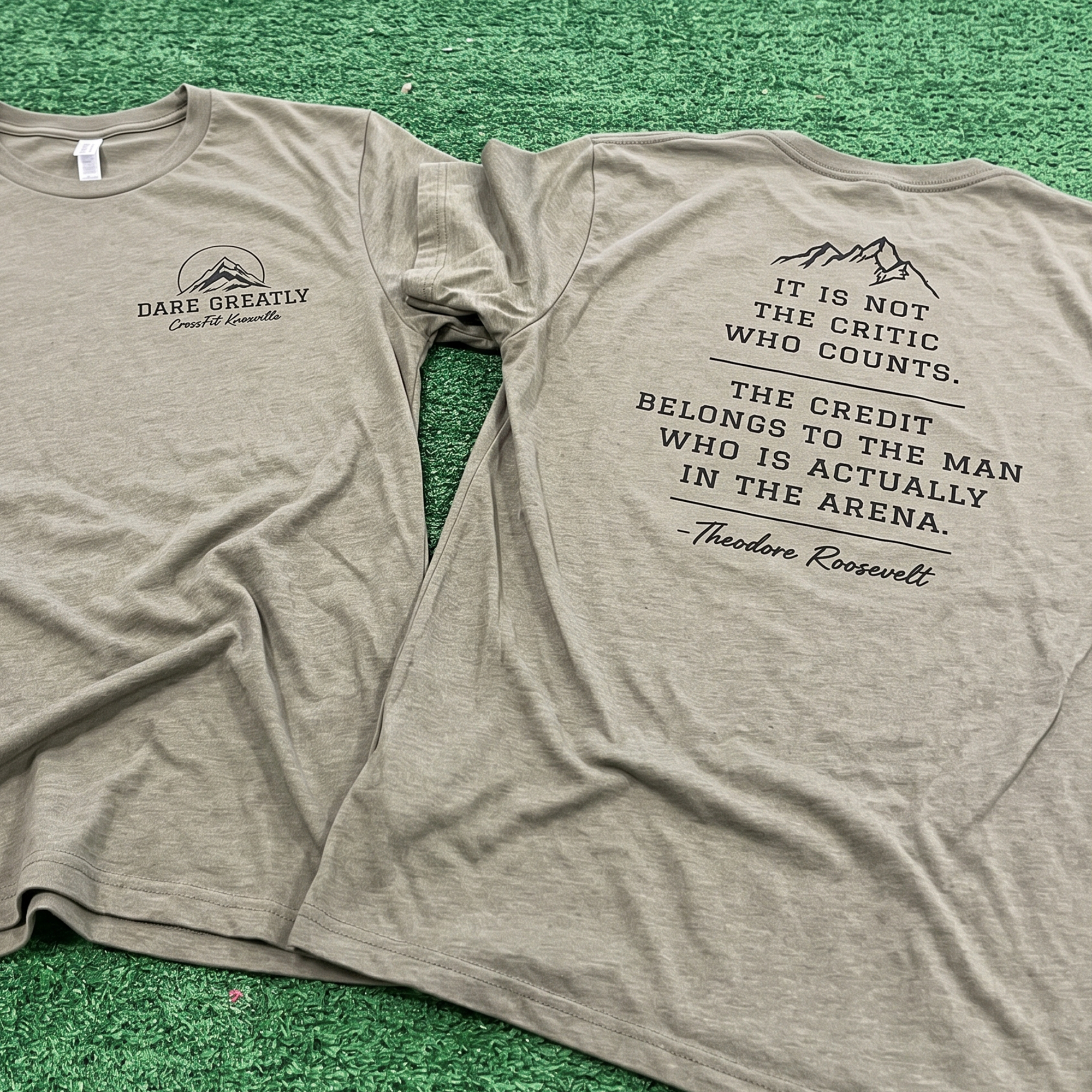 Tan T-shirt with Dare Greatly front print and Theodore Roosevelt quote on back.
