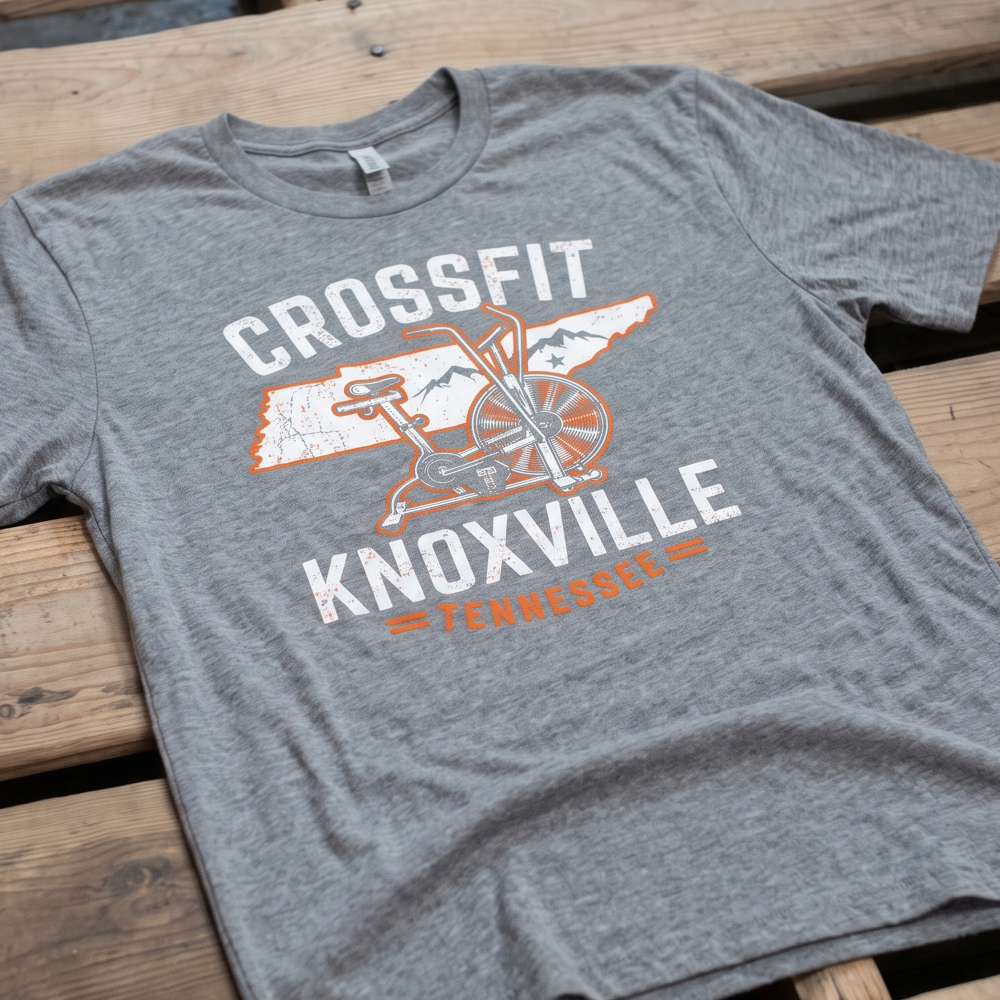Heather gray T-shirt with distressed CrossFit Knoxville air-bike and Tennessee graphic.