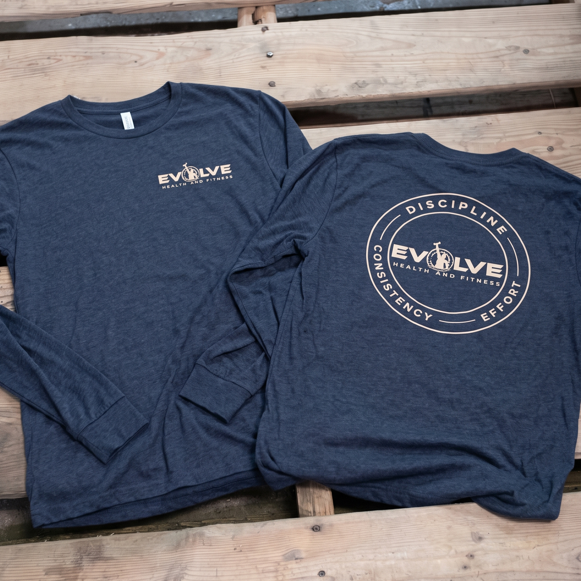 Navy long-sleeve shirts with tan chest logo and circular back print.